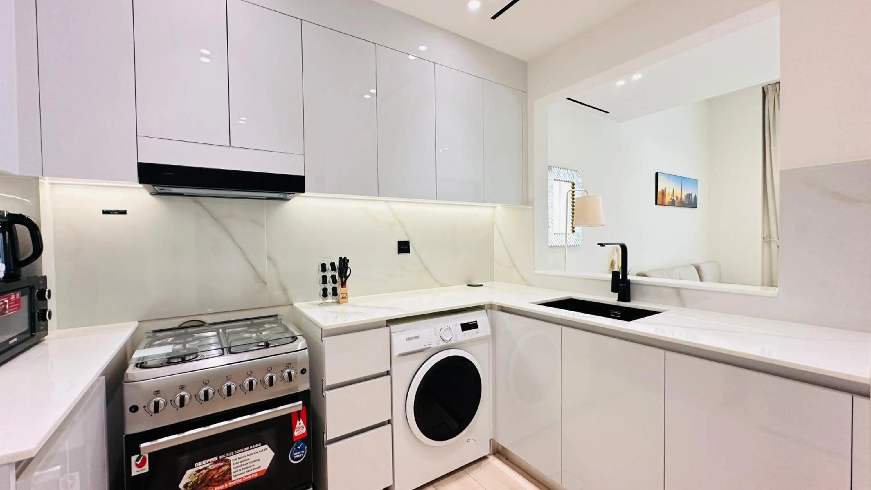 Kitchen or kitchenette in OYO 1292 Home Fully Furnished 1bed Apt @JVC