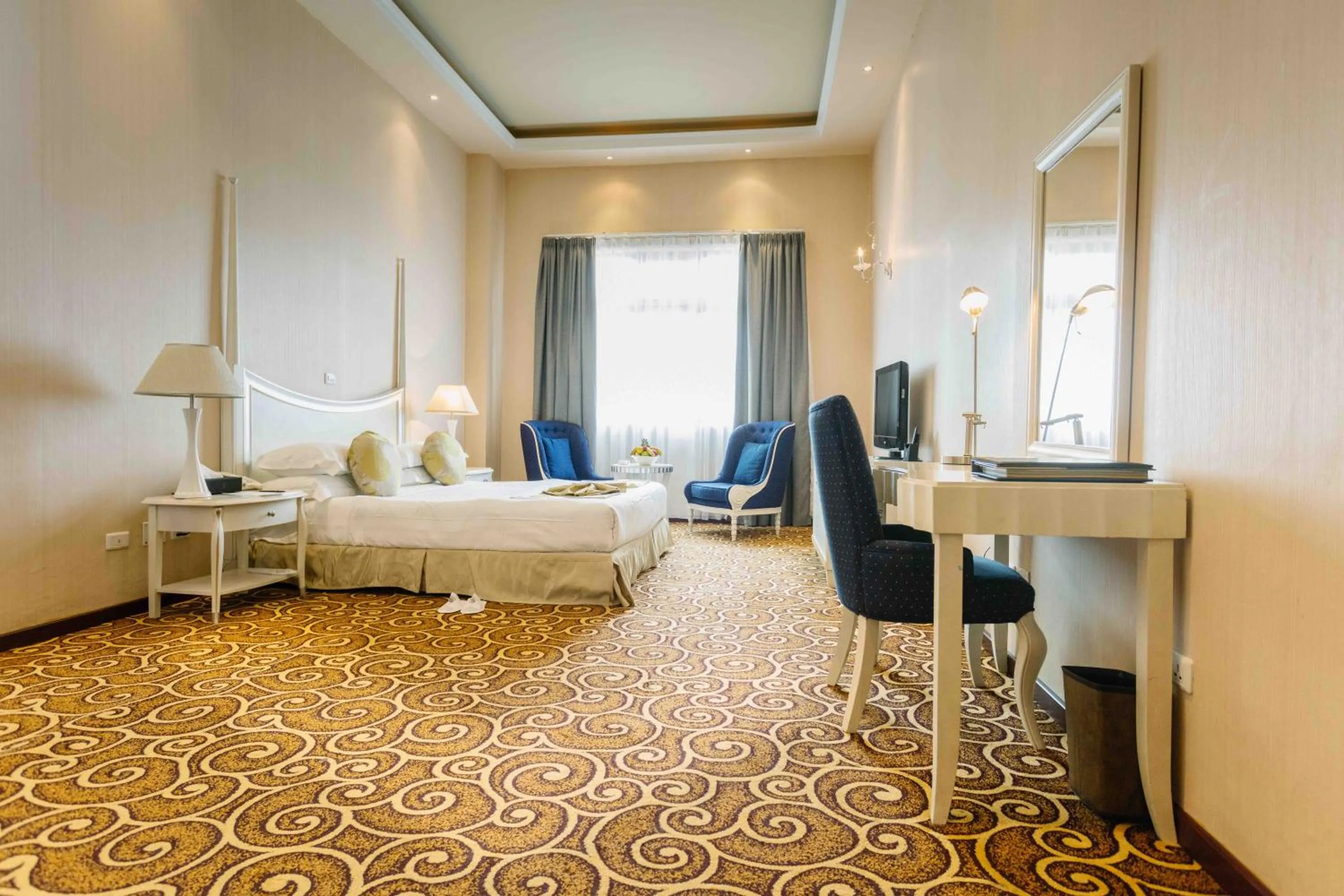 Bedroom in Ambassador Hotel