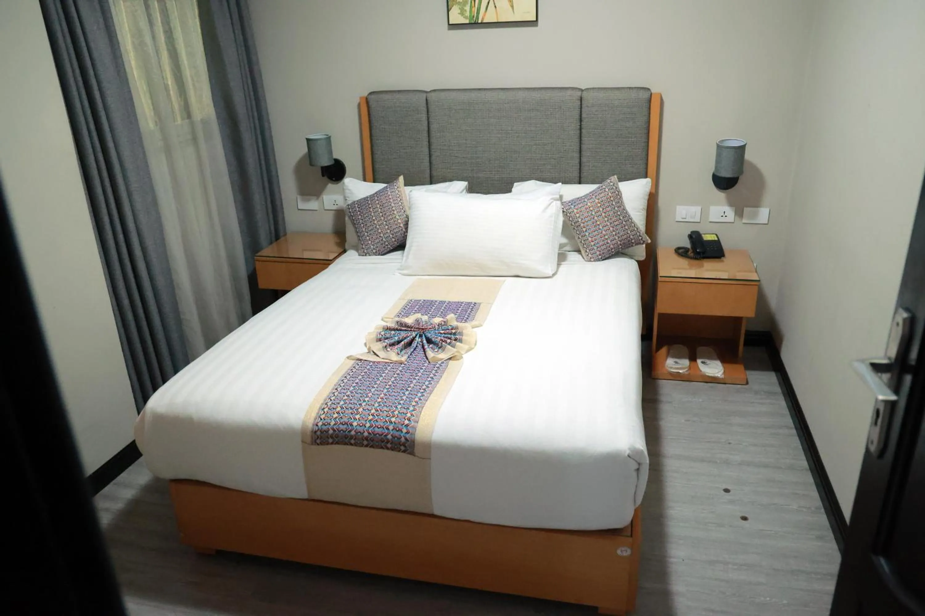 Bed in Ambassador Hotel