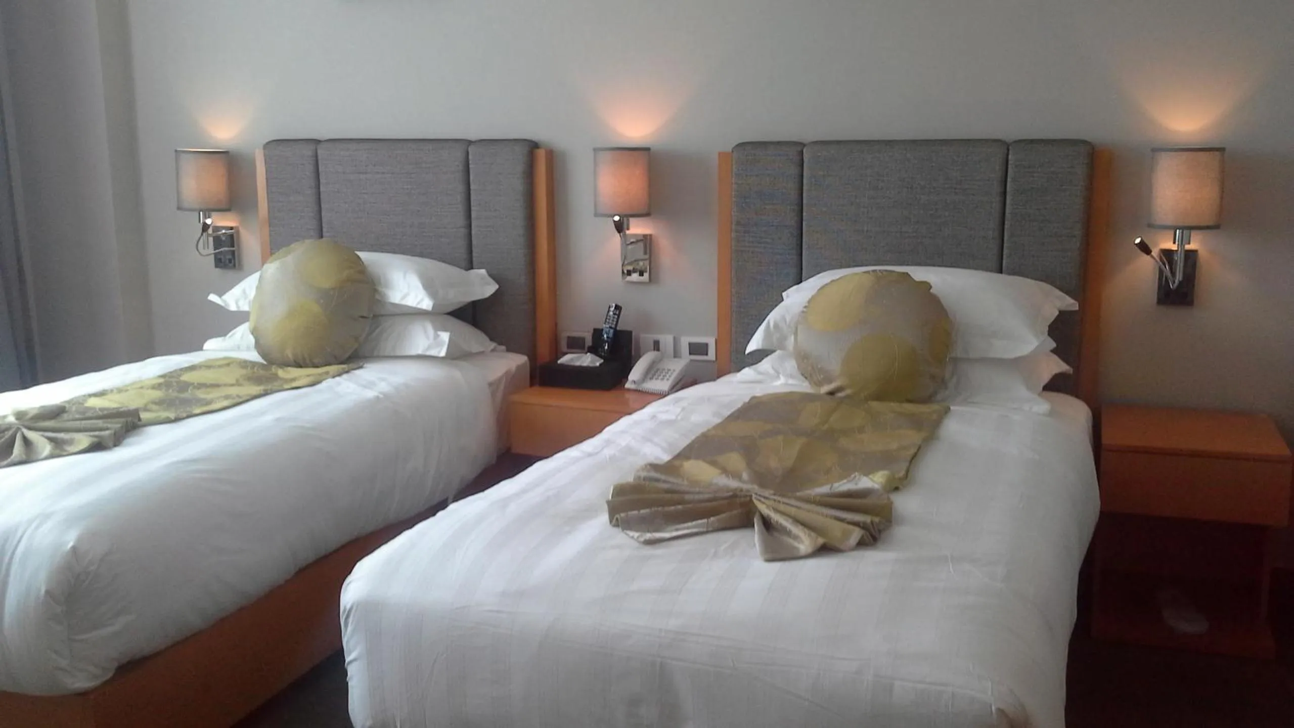 Bed in Ambassador Hotel