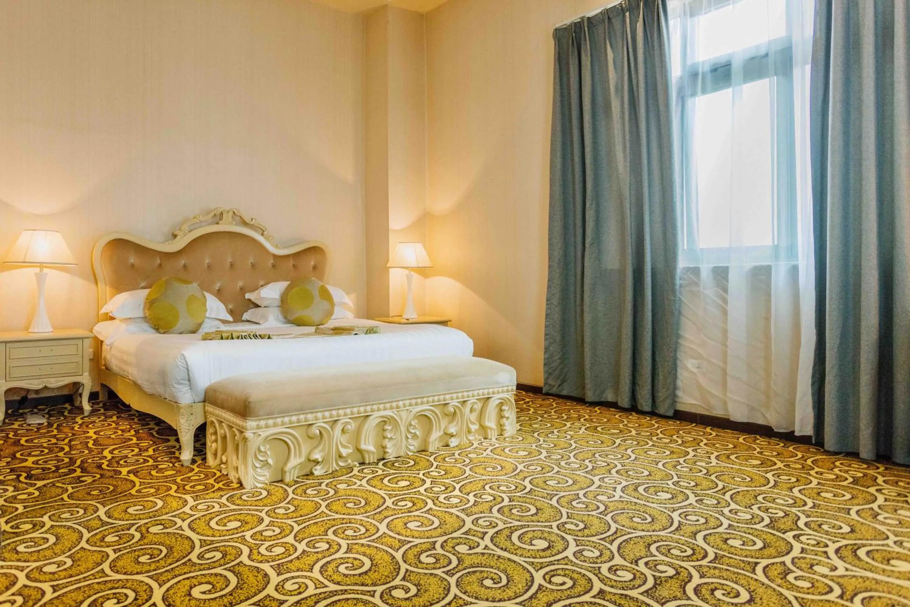 Bed in Ambassador Hotel