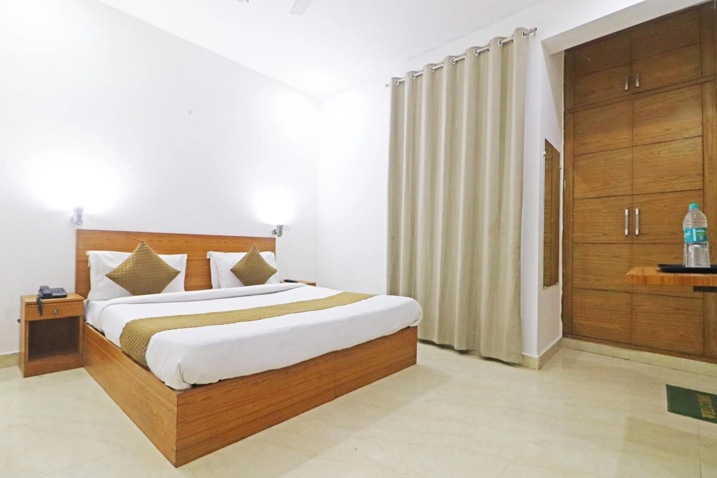 Bed in Mauryan Elite Hotel Chhatarpur Metro Station