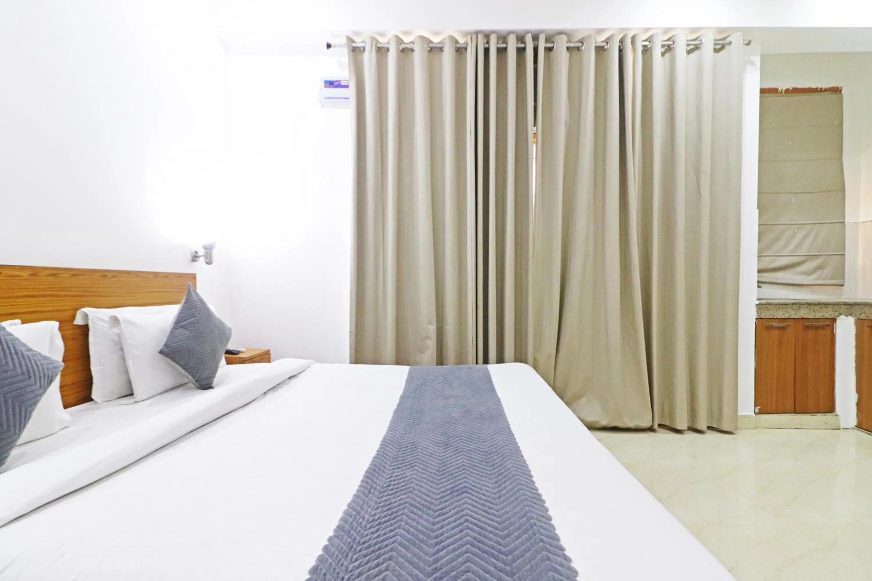 Bed in Mauryan Elite Hotel Chhatarpur Metro Station