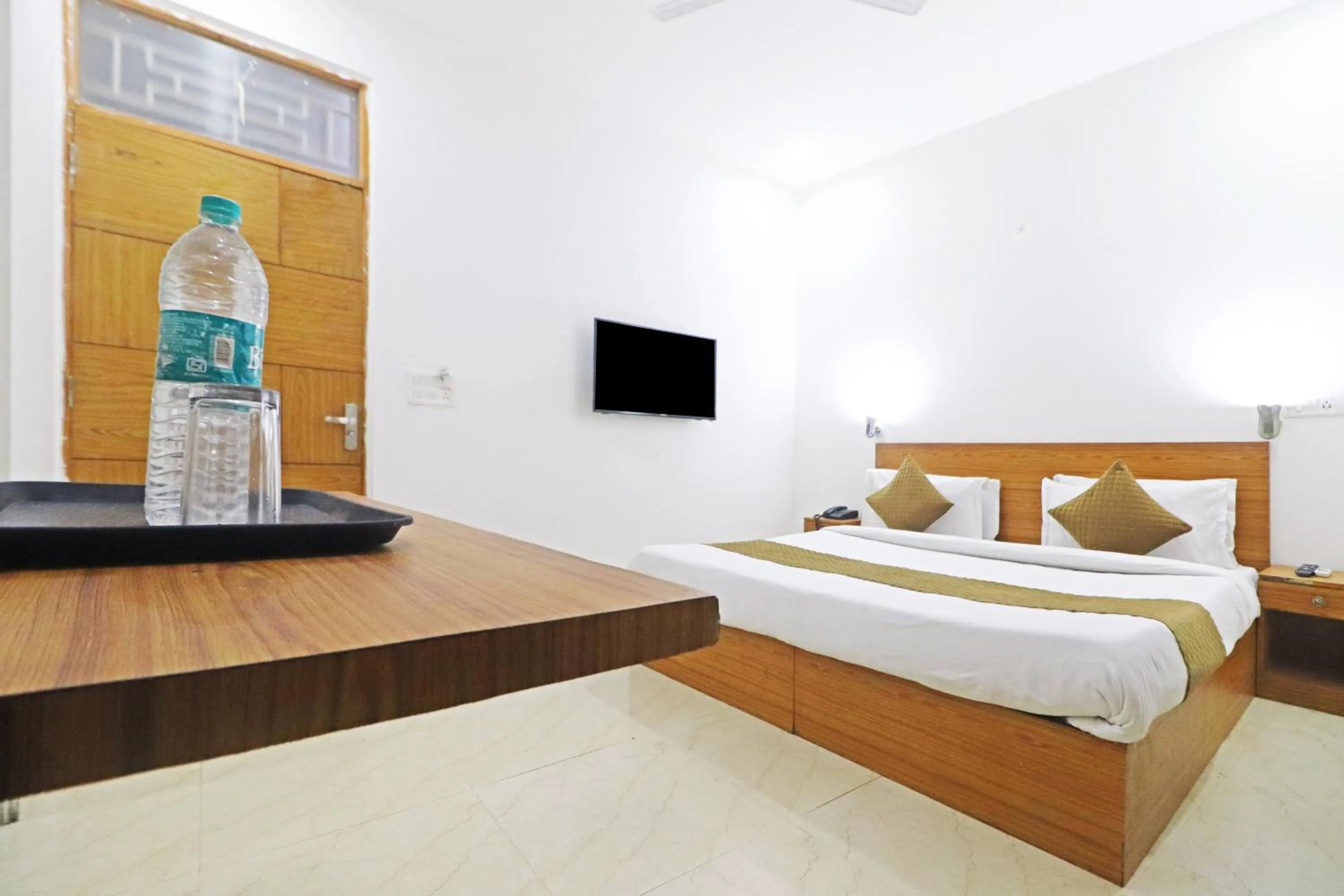 Bed in Mauryan Elite Hotel Chhatarpur Metro Station