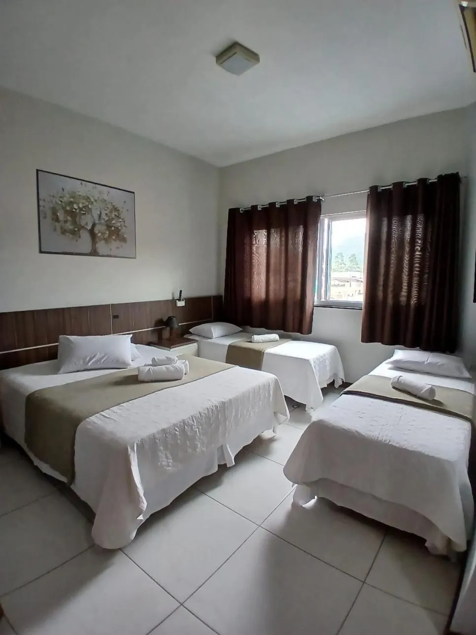 Bed in Miotto Executive Hotel