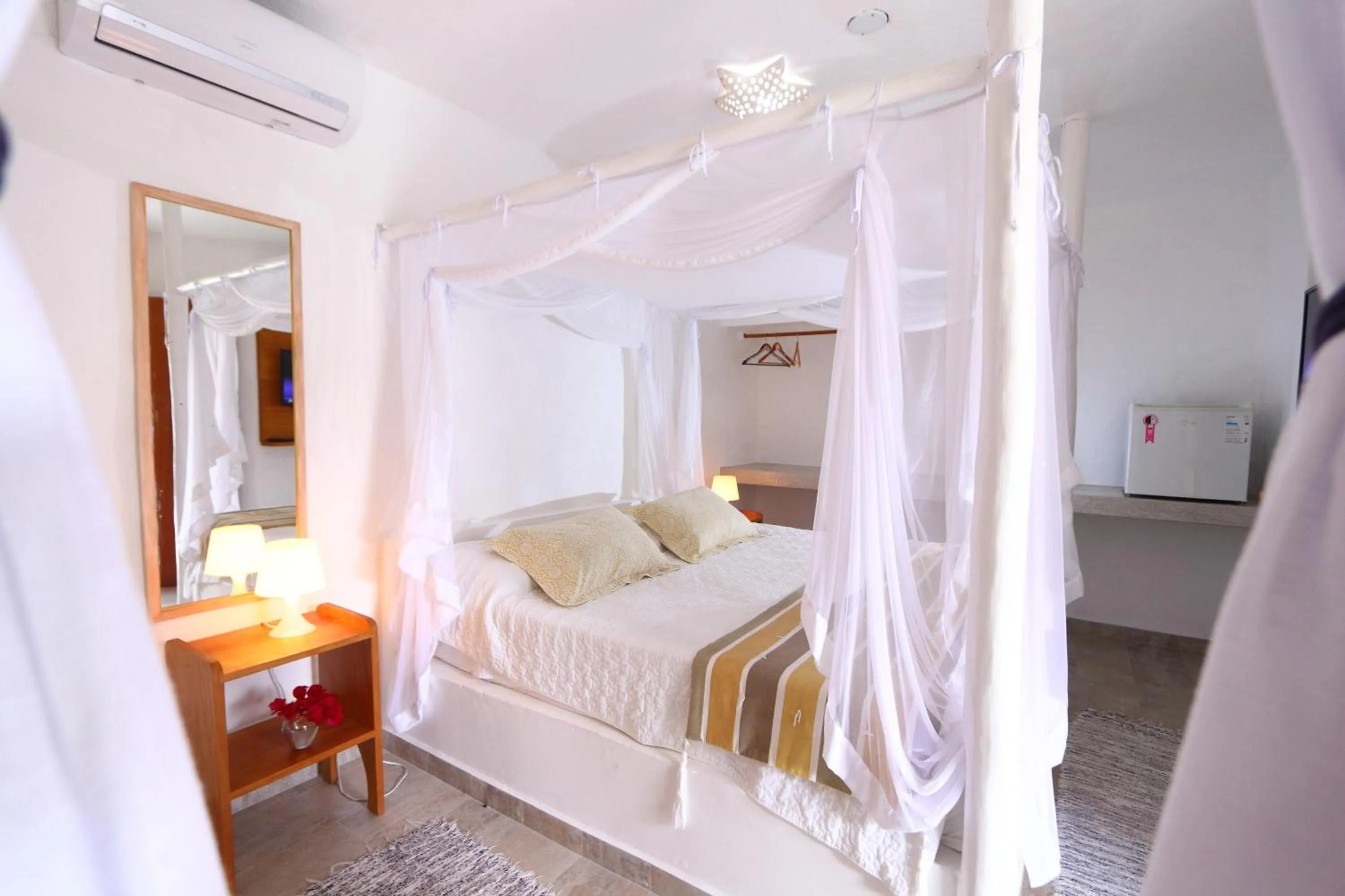 Bed in Pousada Rigatoni