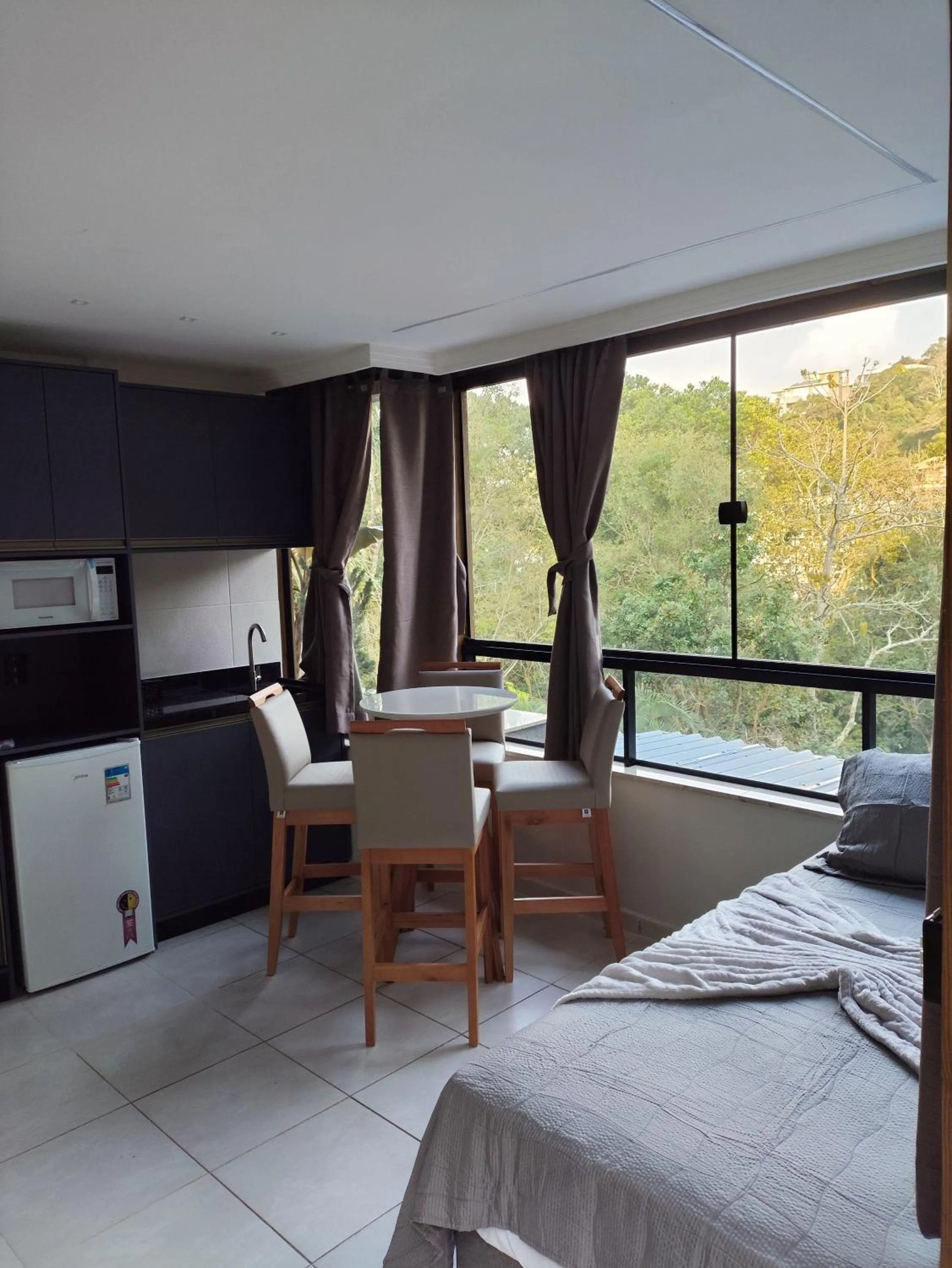 Bed in Bombinhas Guest House