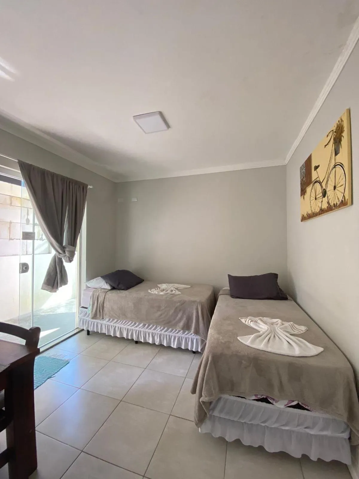 Bed in Bombinhas Guest House