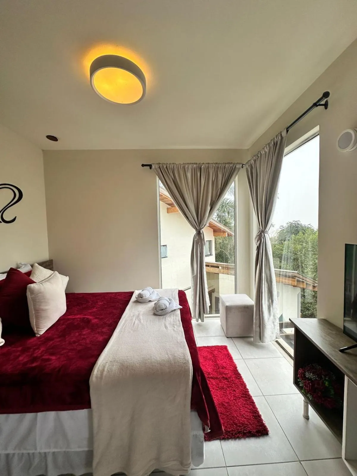 Bed in Bombinhas Guest House