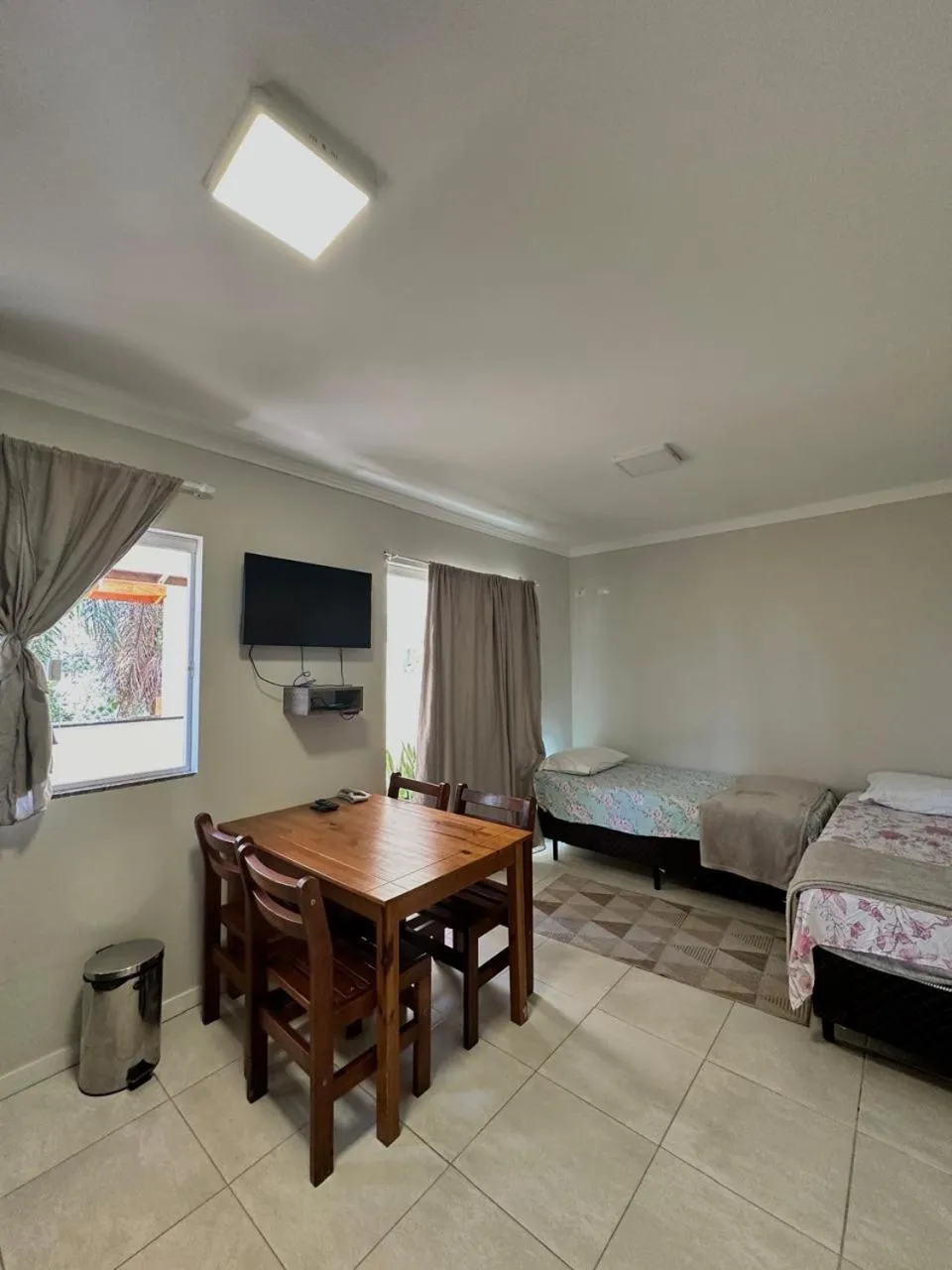 Bed in Bombinhas Guest House