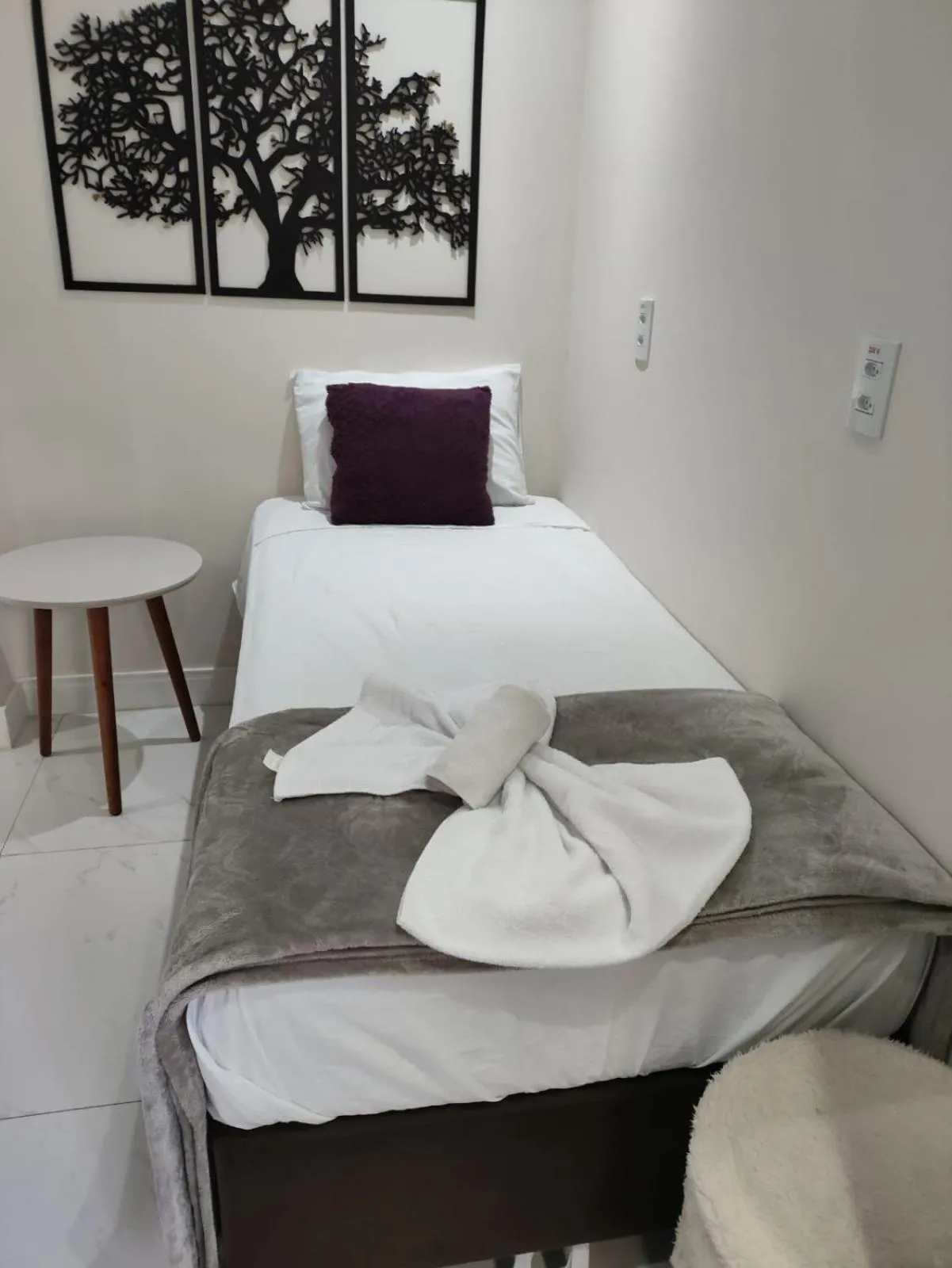 Bed in Bombinhas Guest House