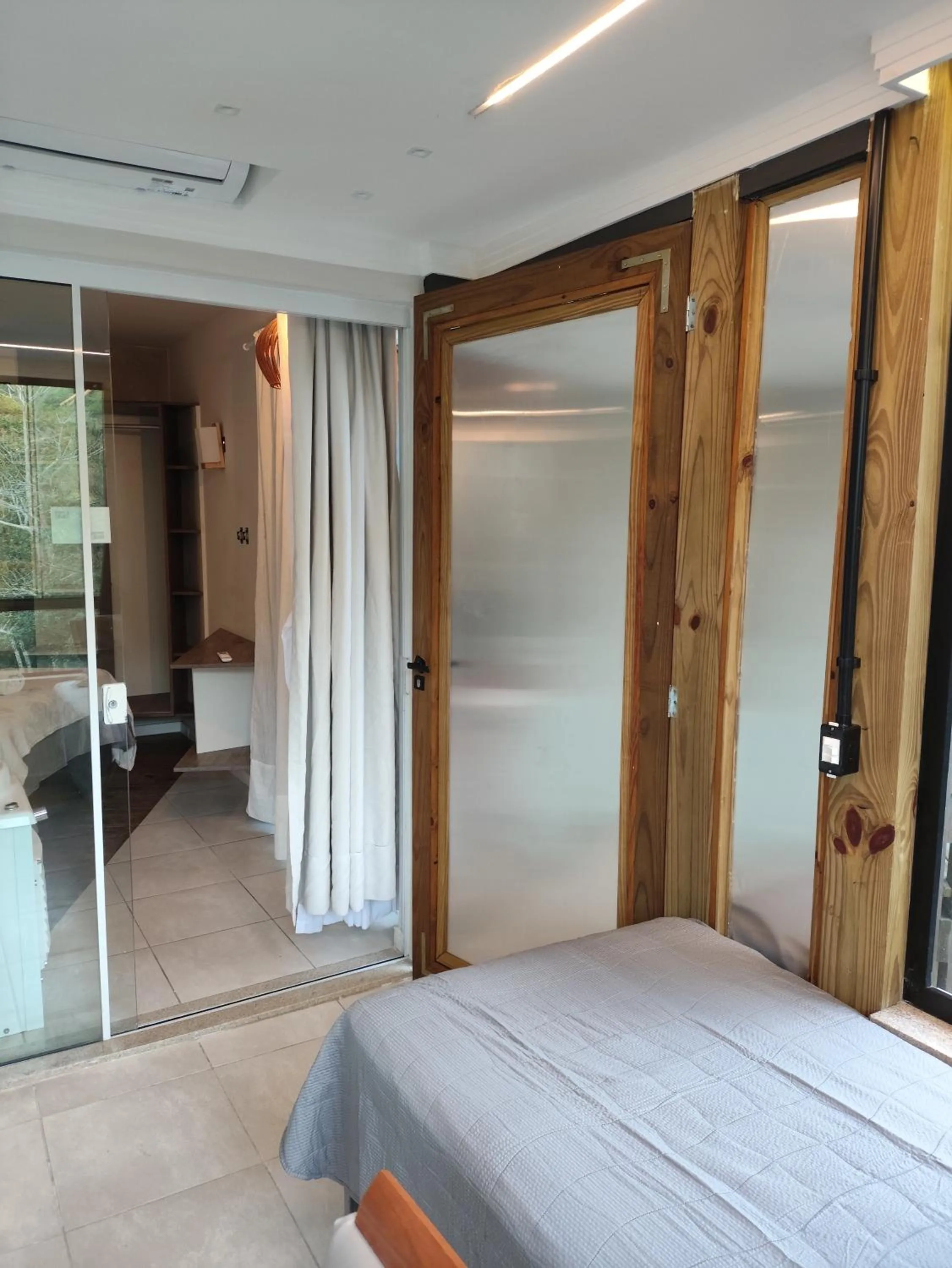 Bed in Bombinhas Guest House