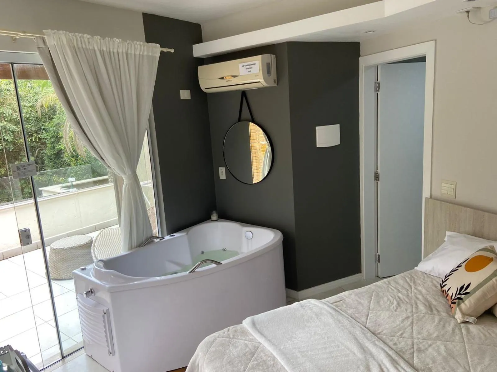 Bed in Bombinhas Guest House