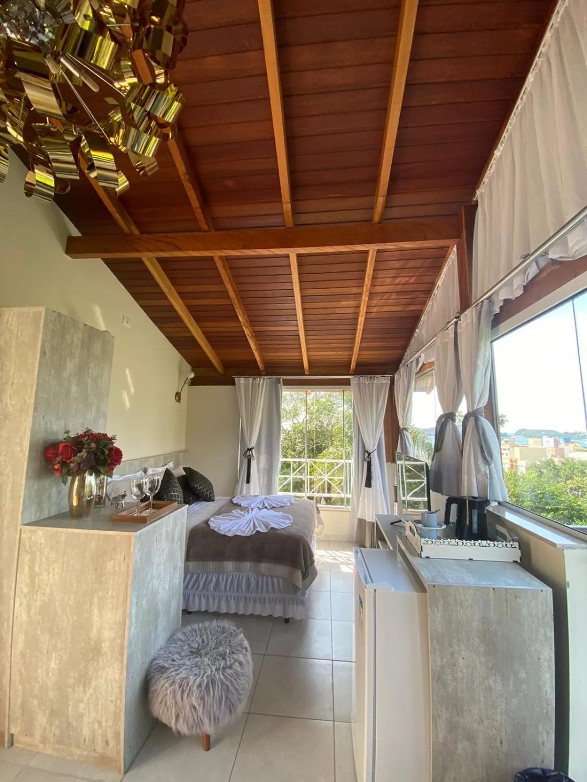 Bed in Bombinhas Guest House