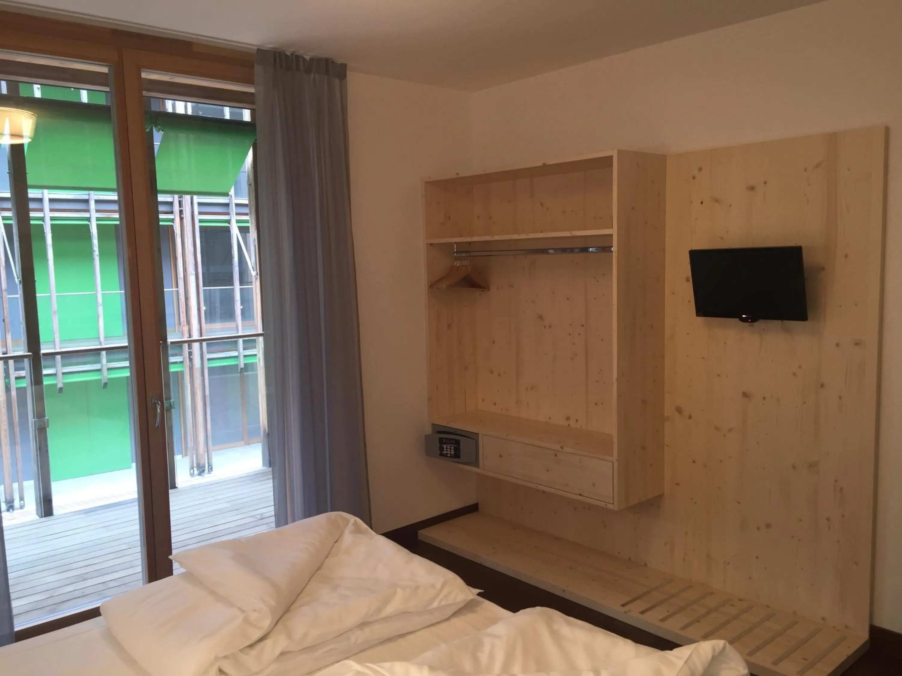 Bed in Komodo short stay apartments