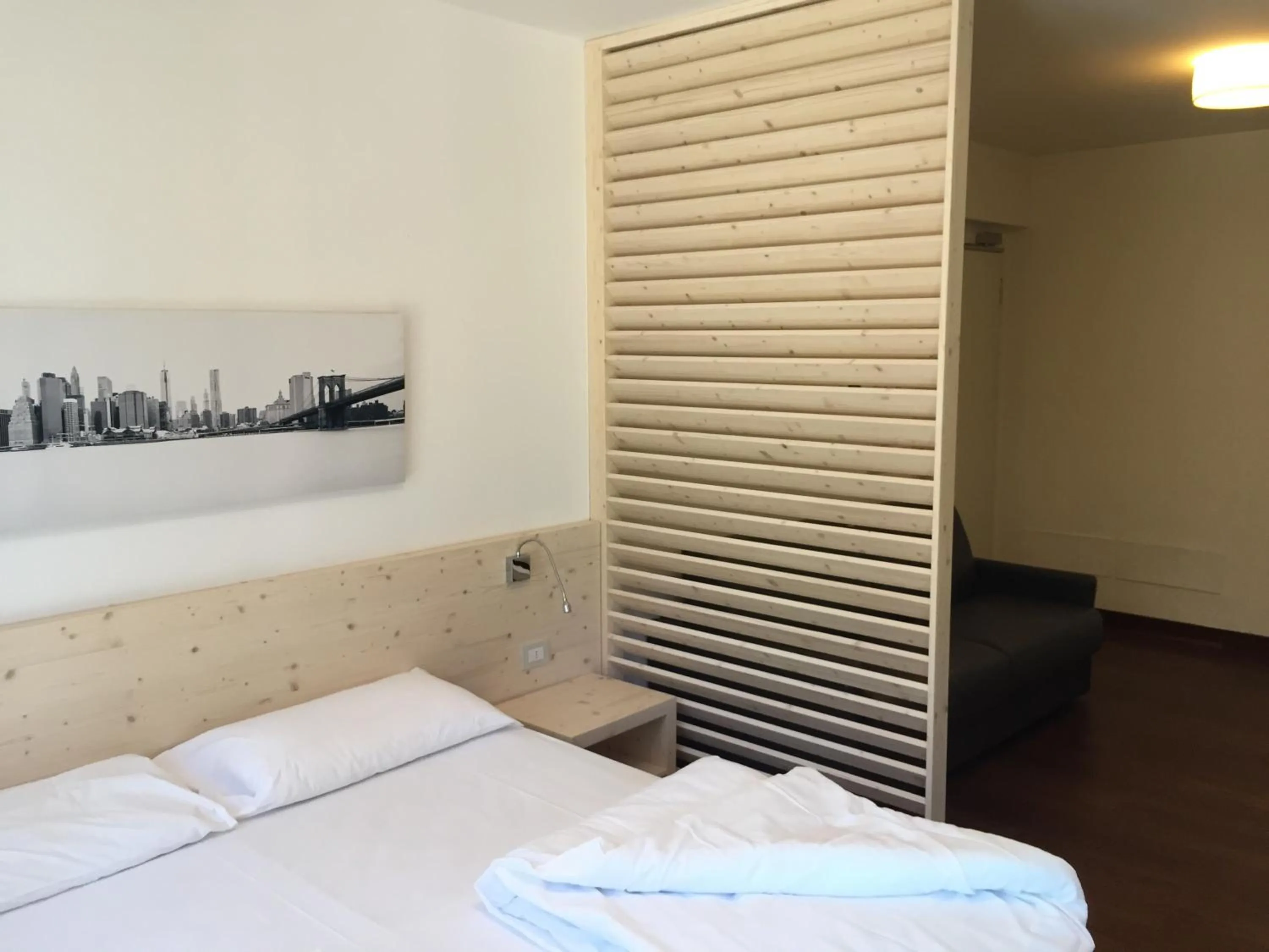 Decorative detail, Bed in Komodo short stay apartments