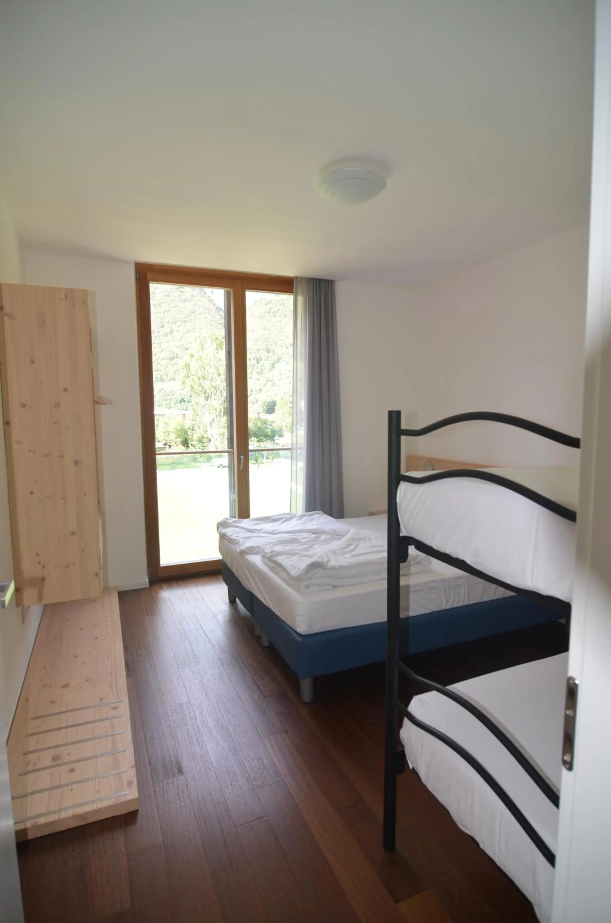 Bed in Komodo short stay apartments