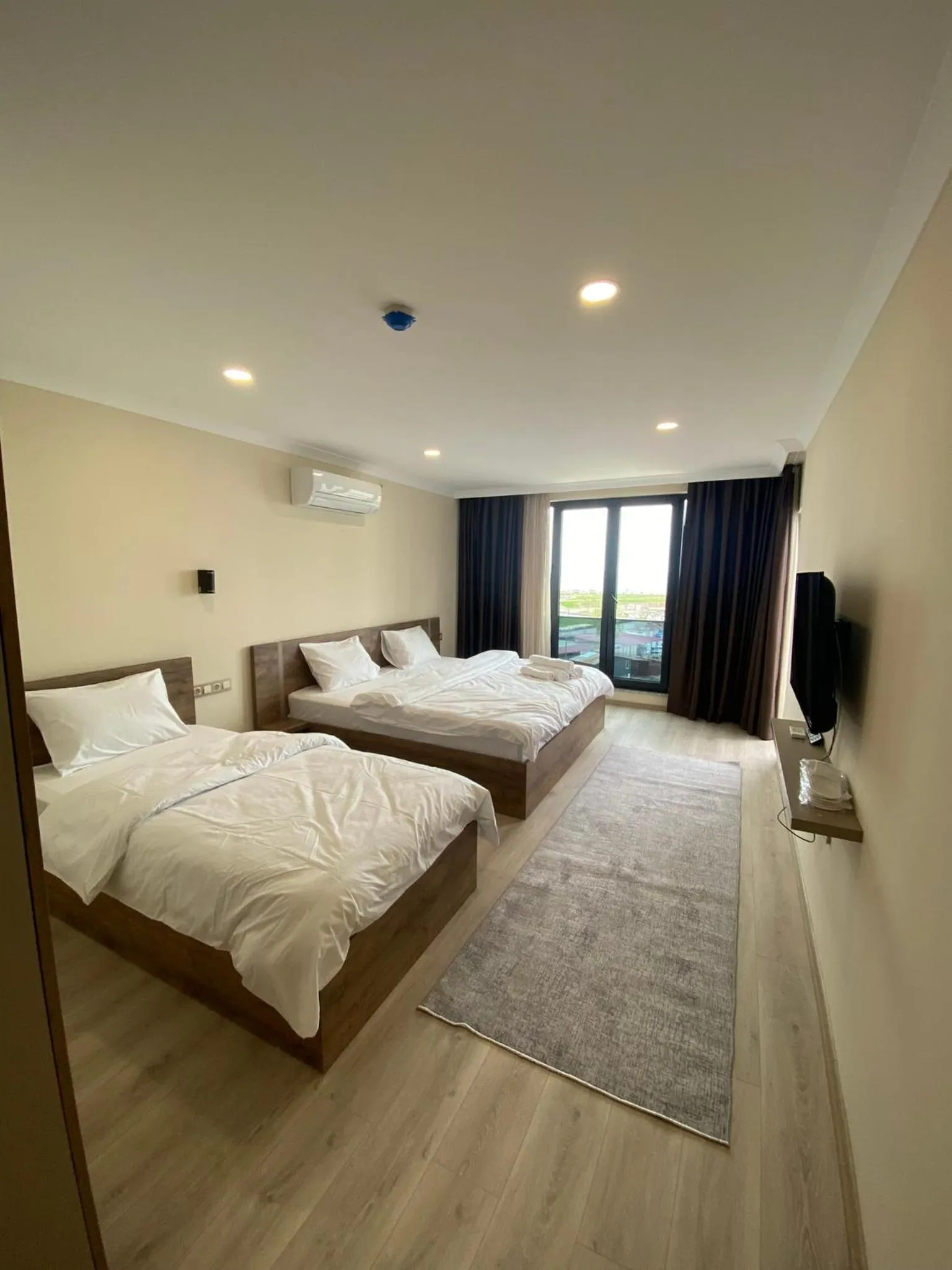 Bed in Rena Grand Residence & Suit