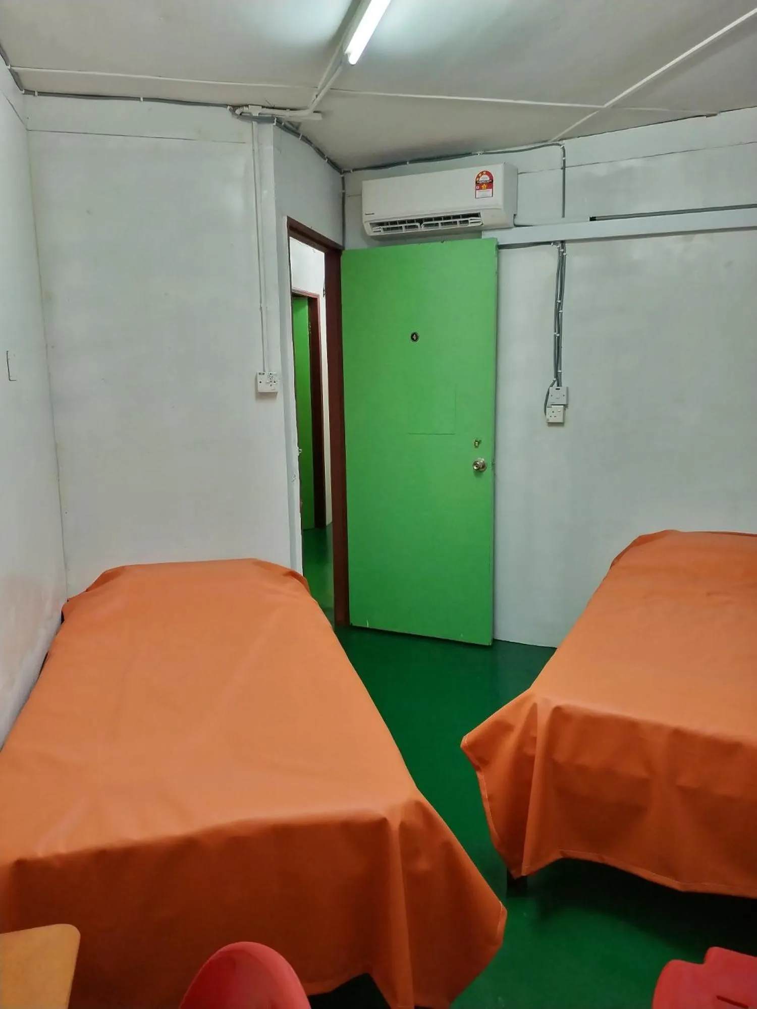 Photo of the whole room, Bed in WISMA ORCHID HOMESTAY Tuaran