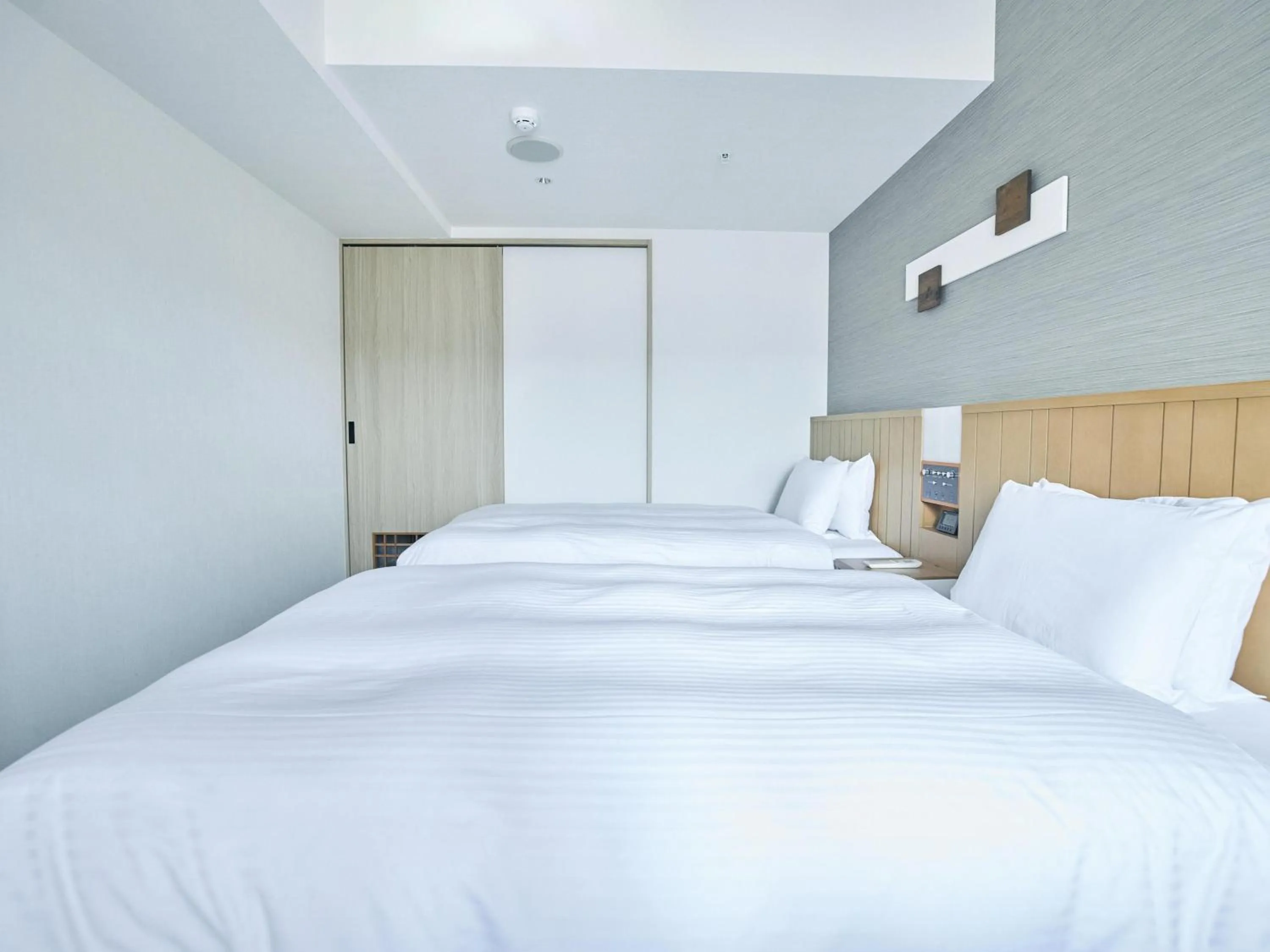 Bed in Hotel Traveltine Kyoto Kiyamachi