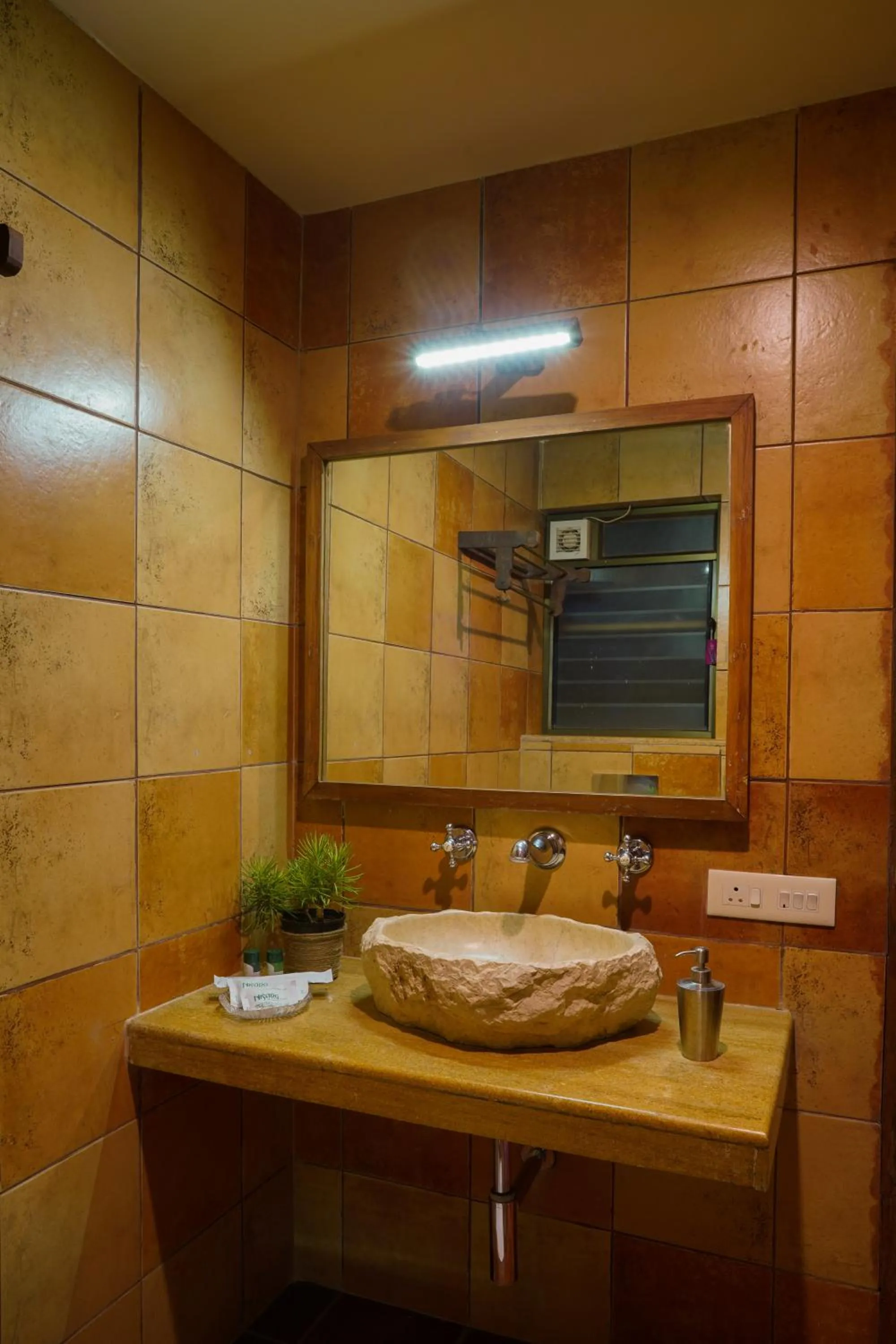 Bathroom in Nisarg Resort