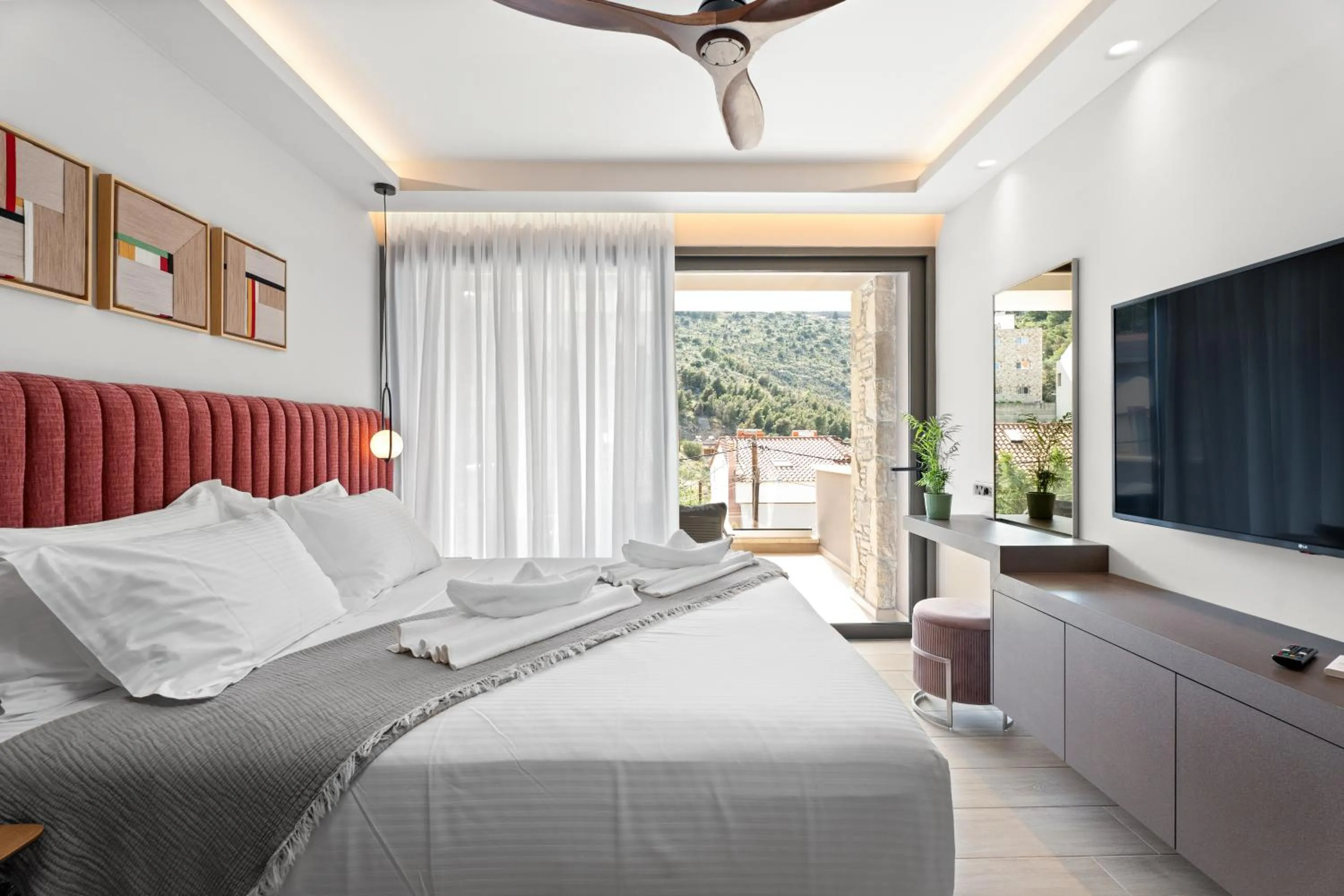 Bed in Ennea Muses Rooms and Suites