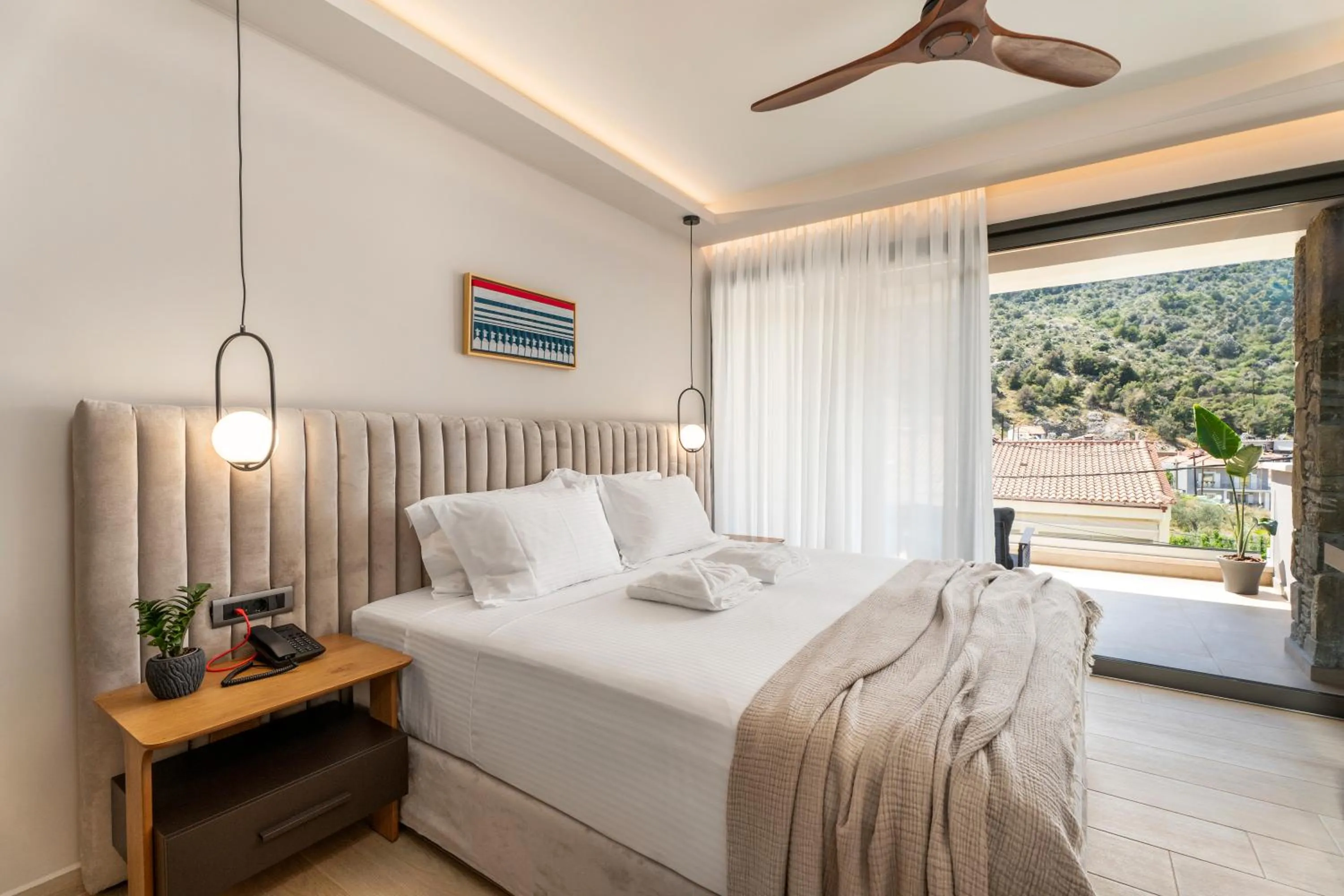 Bed in Ennea Muses Rooms and Suites