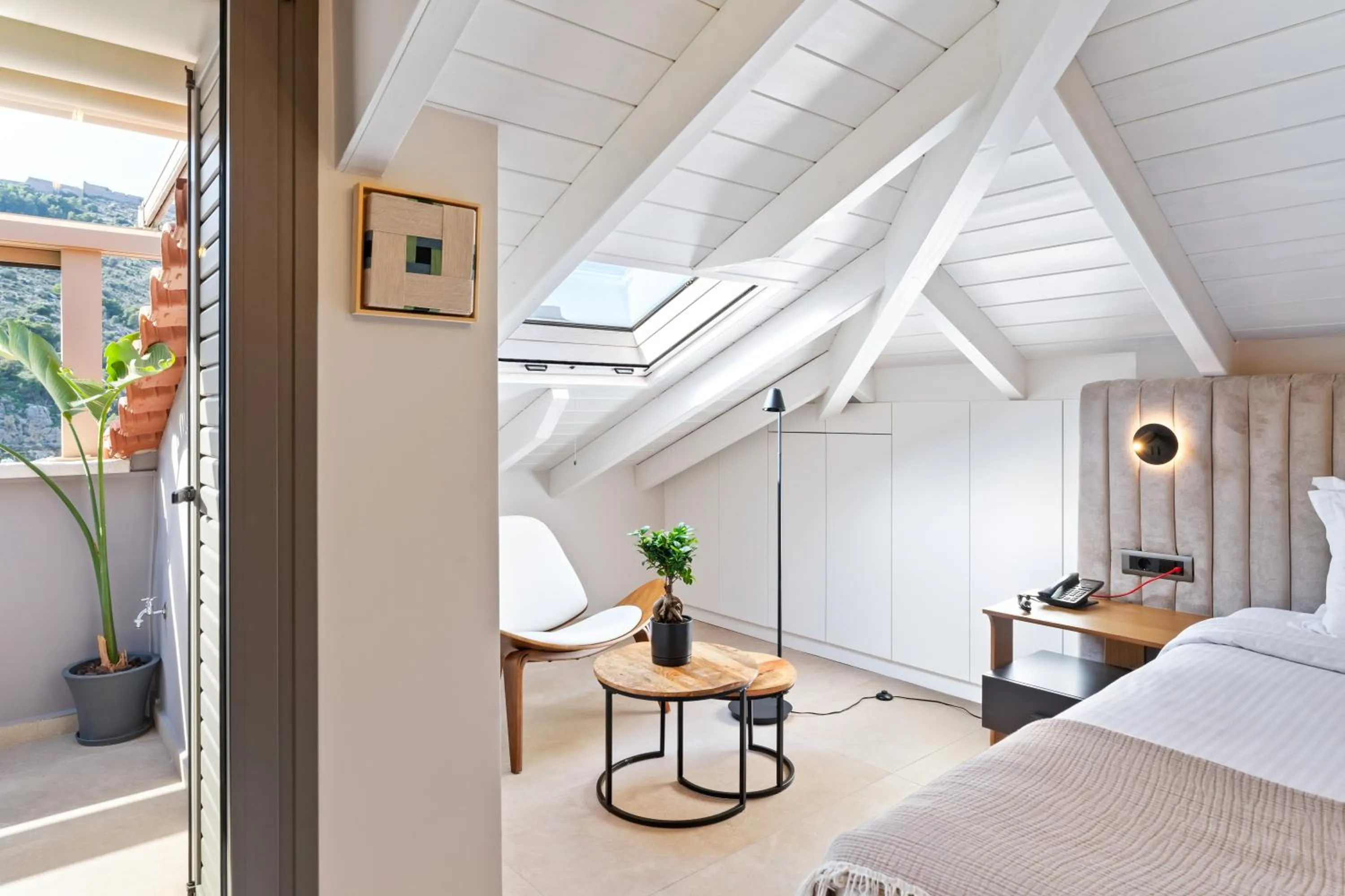 Bed in Ennea Muses Rooms and Suites