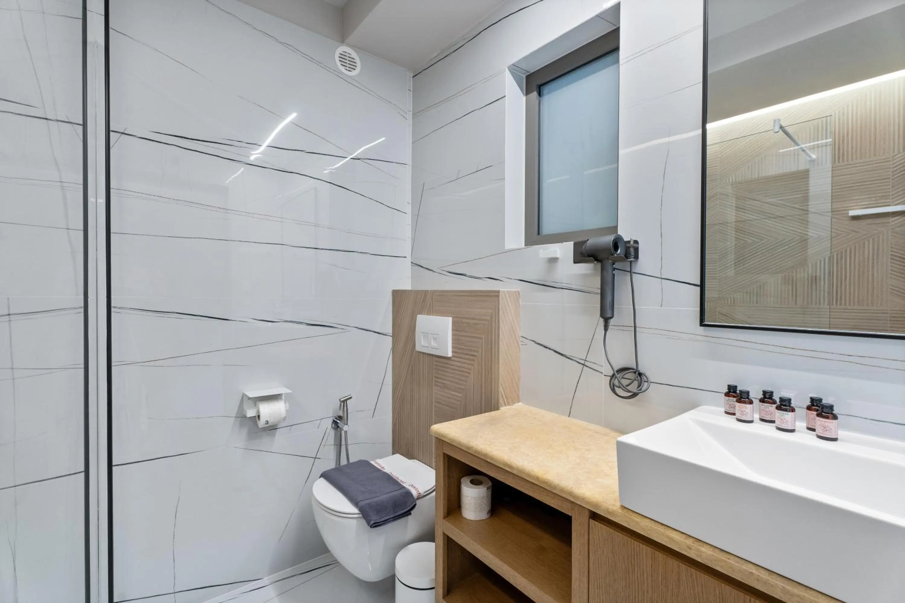 Shower in Ennea Muses Rooms and Suites