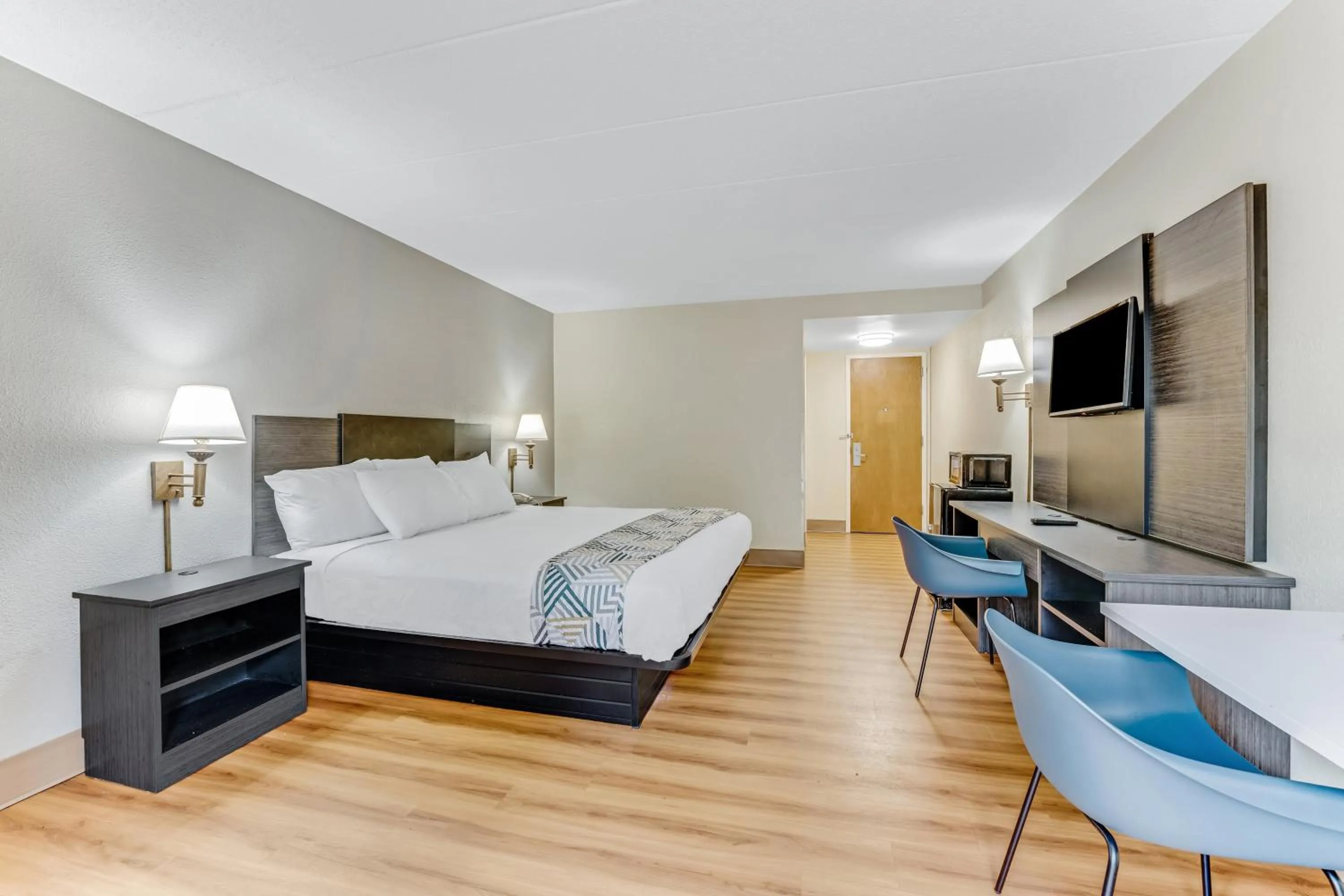 Bed in Red Carpet Inn & Suites