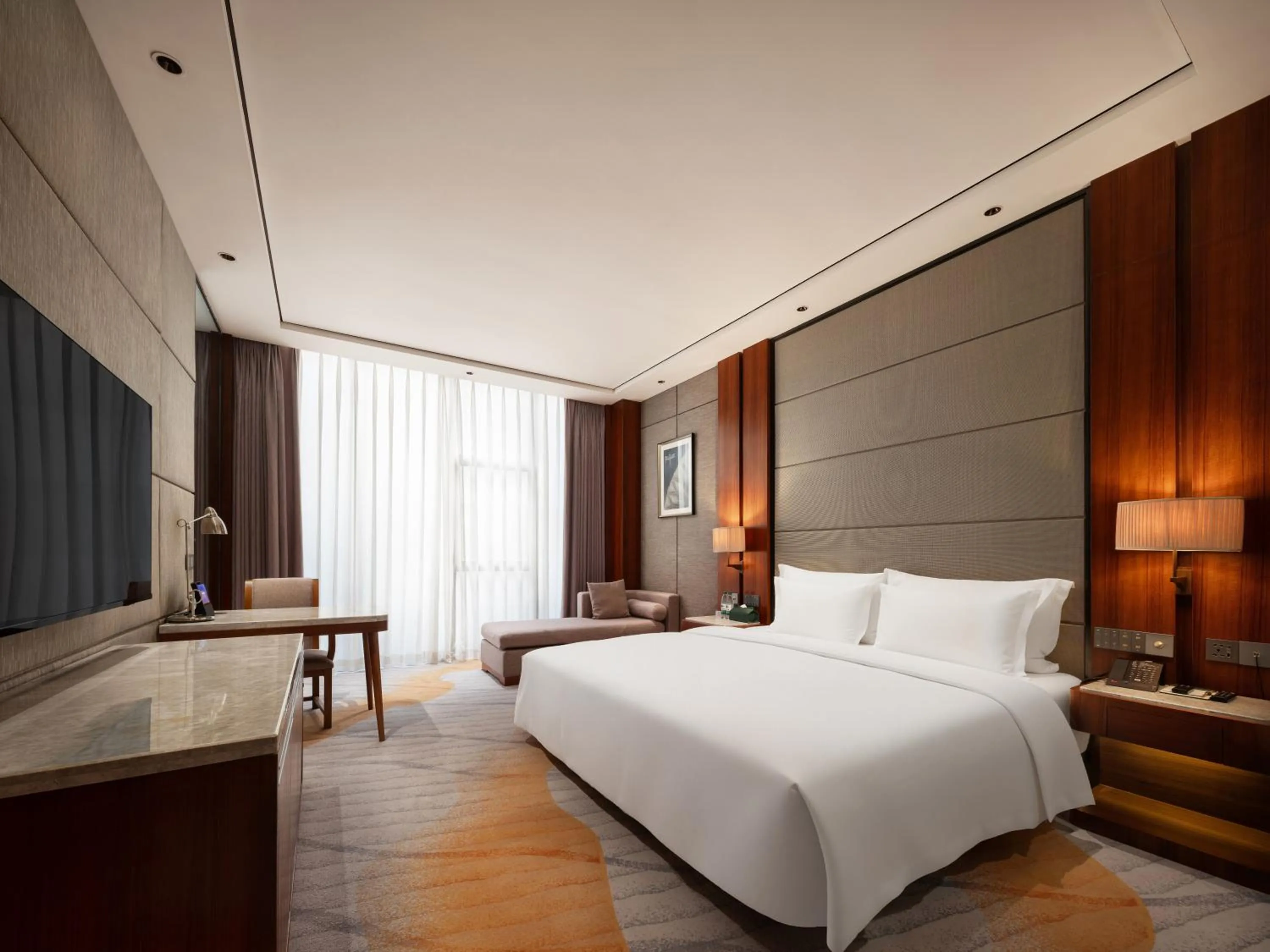 Bed in Zhuhai Palm Spring Hotel