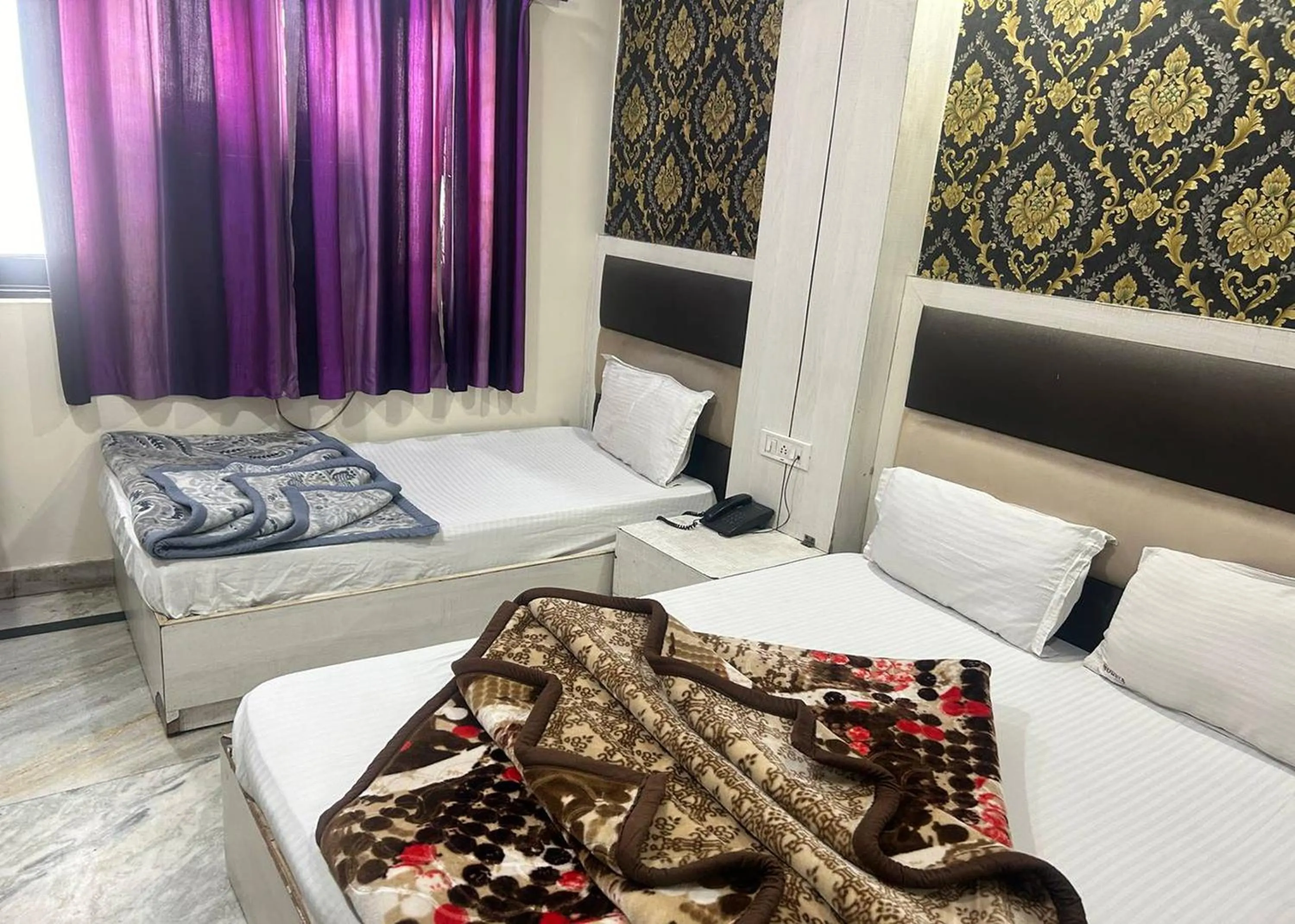 Bed in Hotel Mourya Deluxe