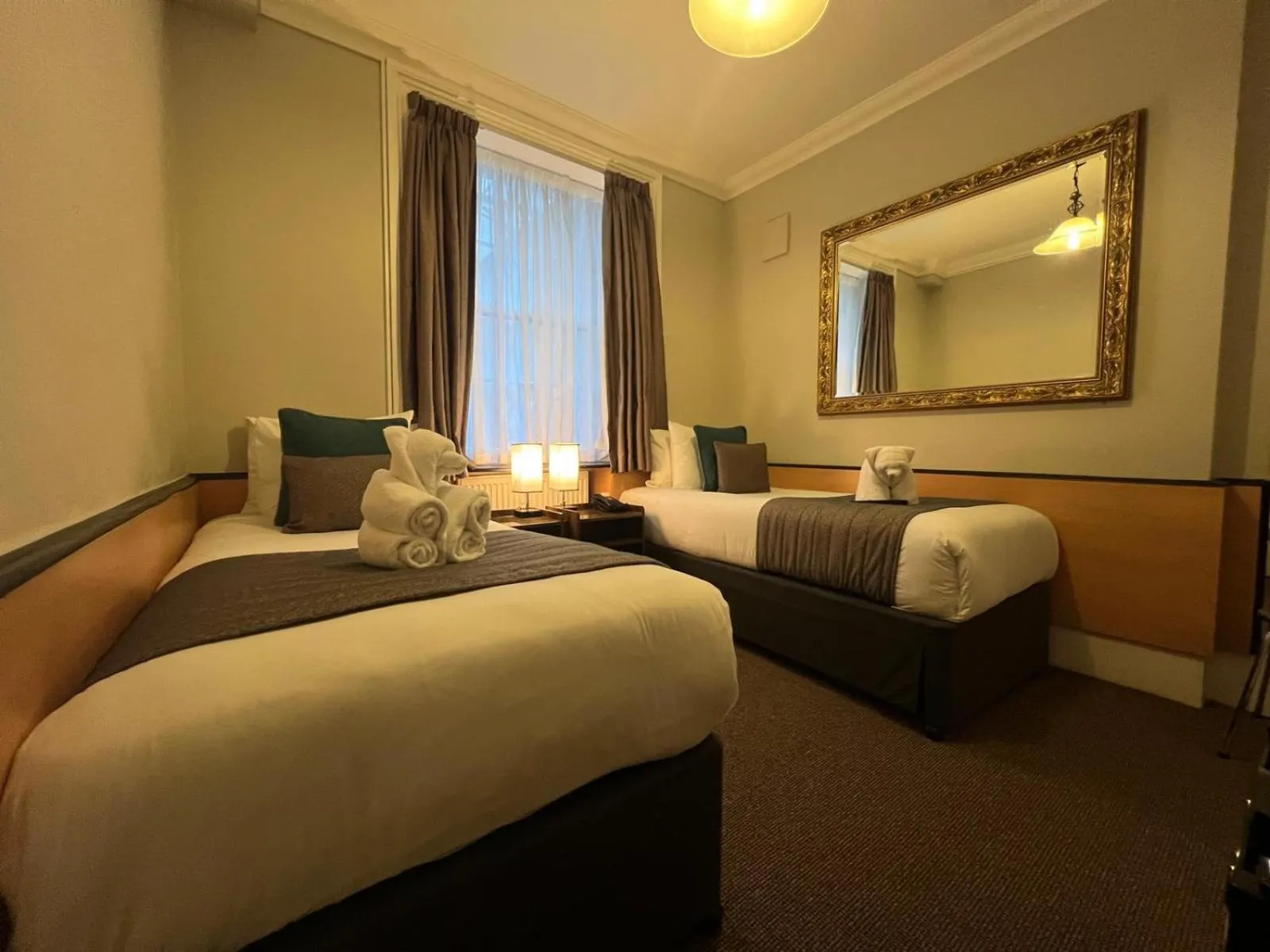 Bed in Tudor Court Hotel