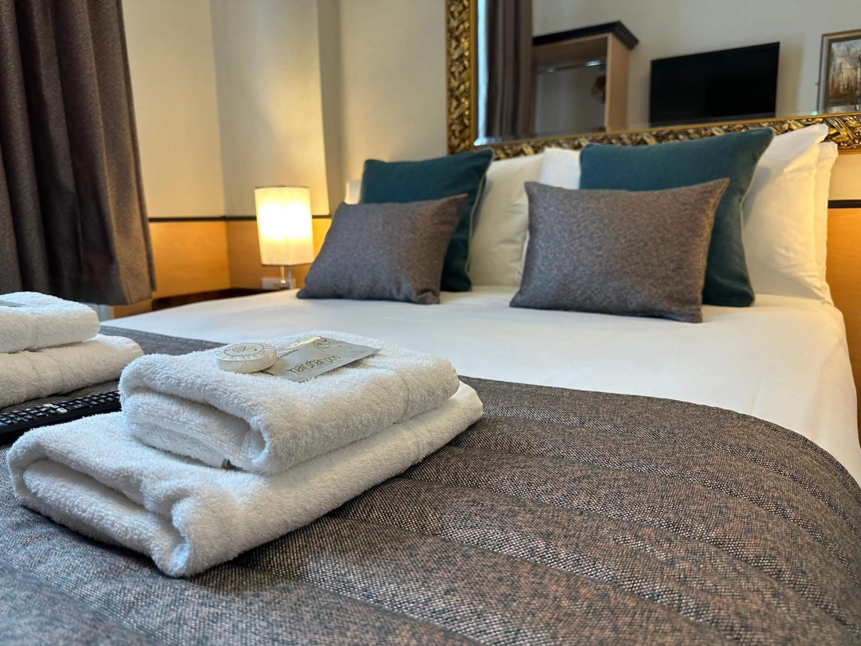 Bed in Tudor Court Hotel