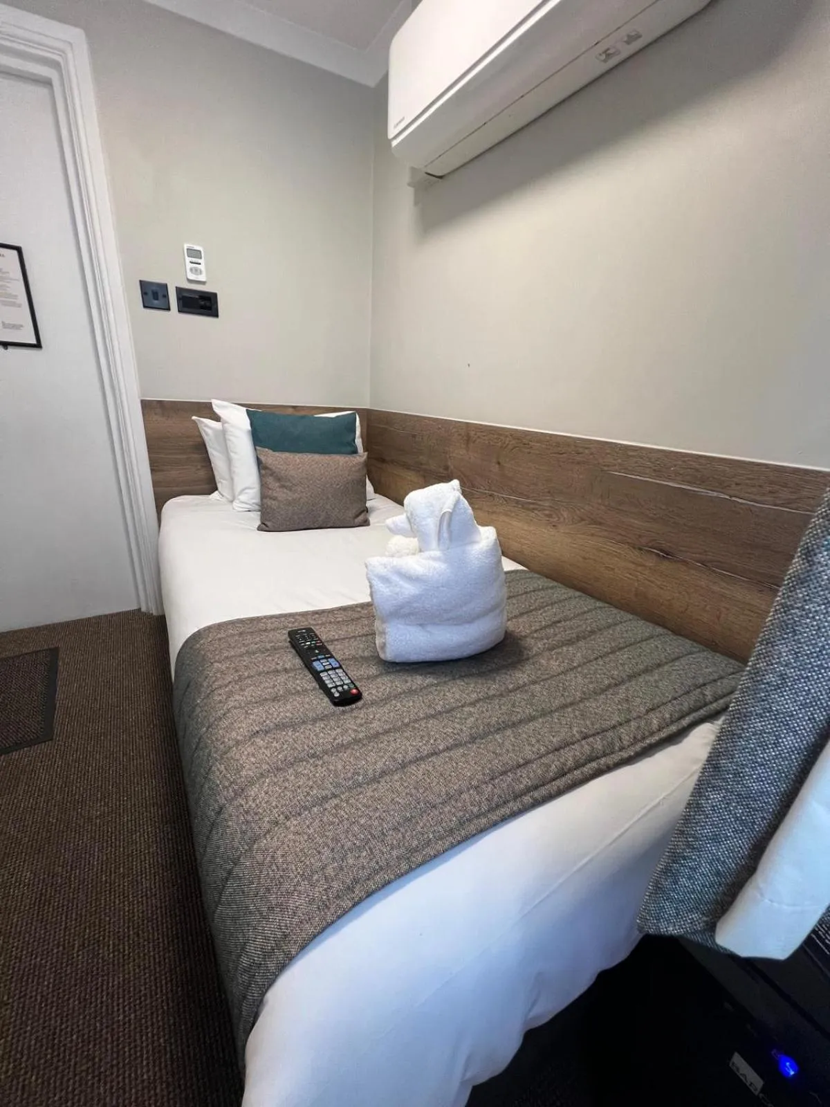 Bed in Tudor Court Hotel