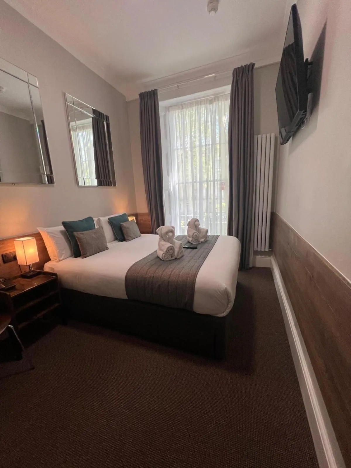 Bed in Tudor Court Hotel