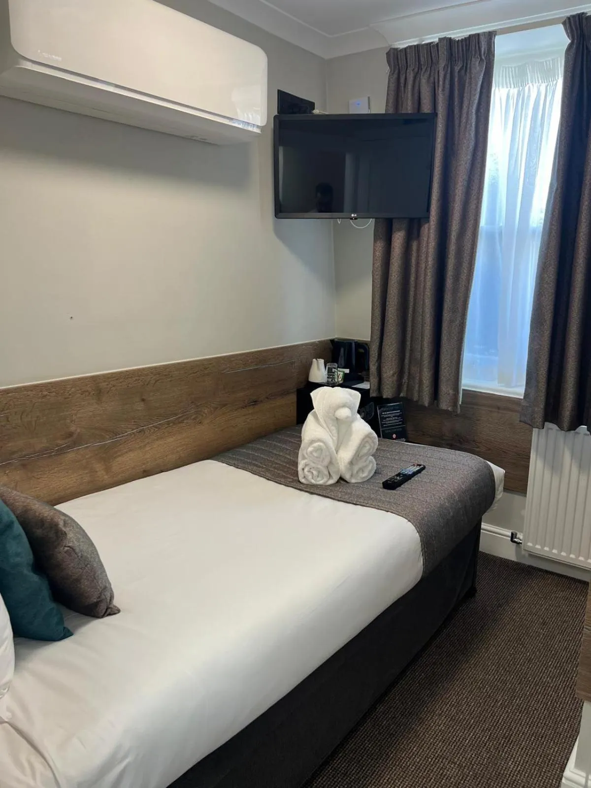 Bed in Tudor Court Hotel