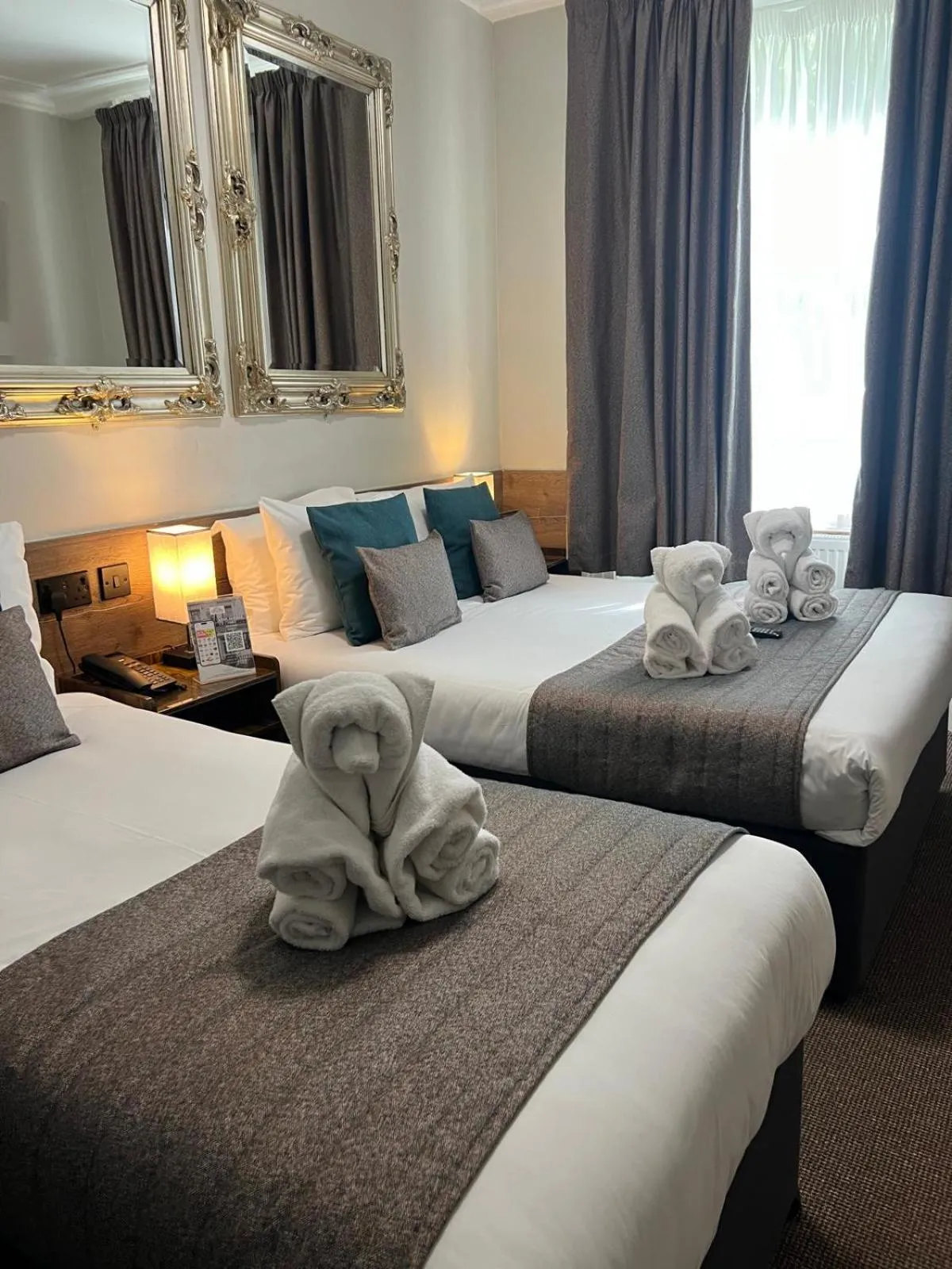 Bed in Tudor Court Hotel