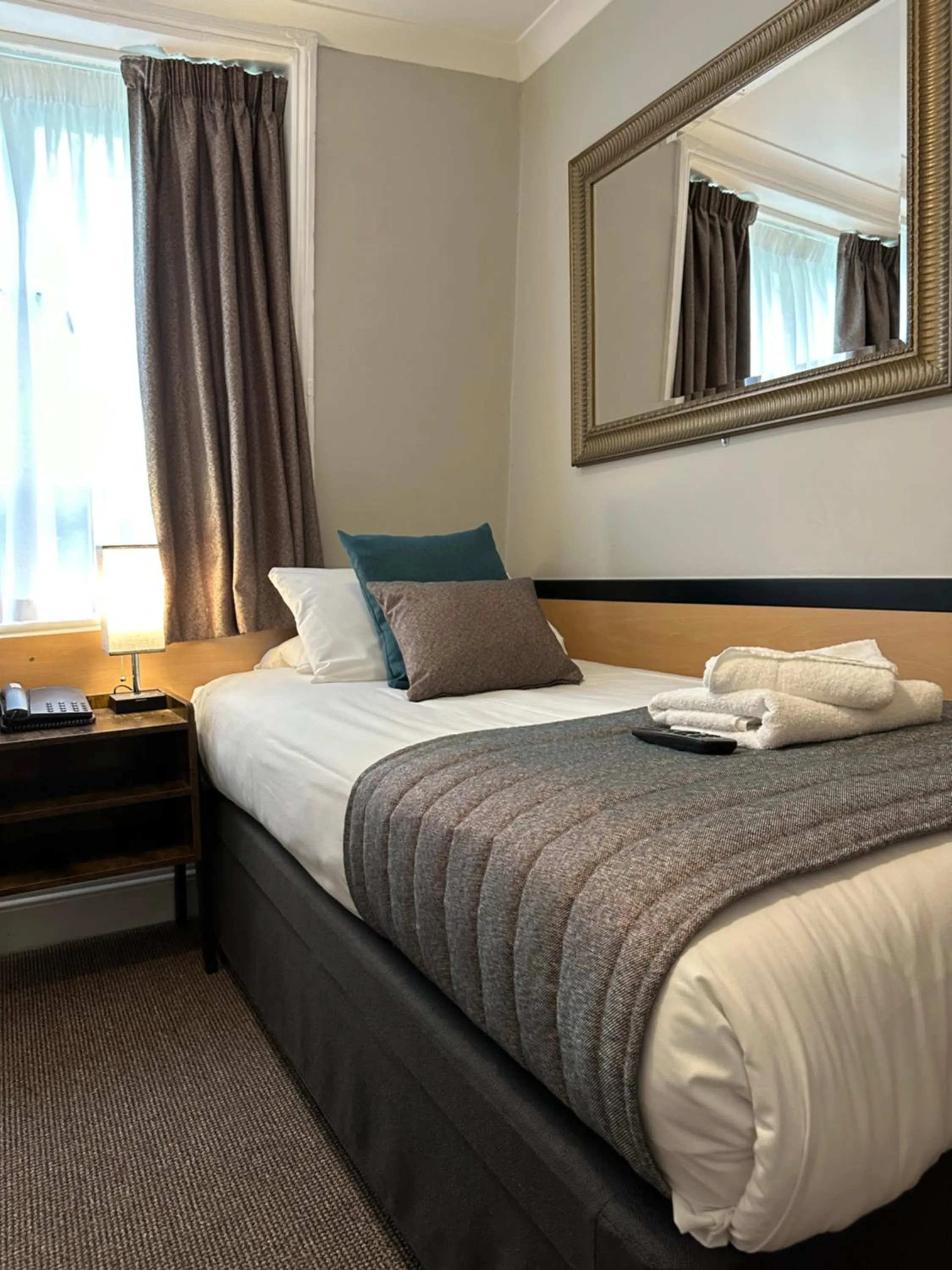 Bed in Tudor Court Hotel