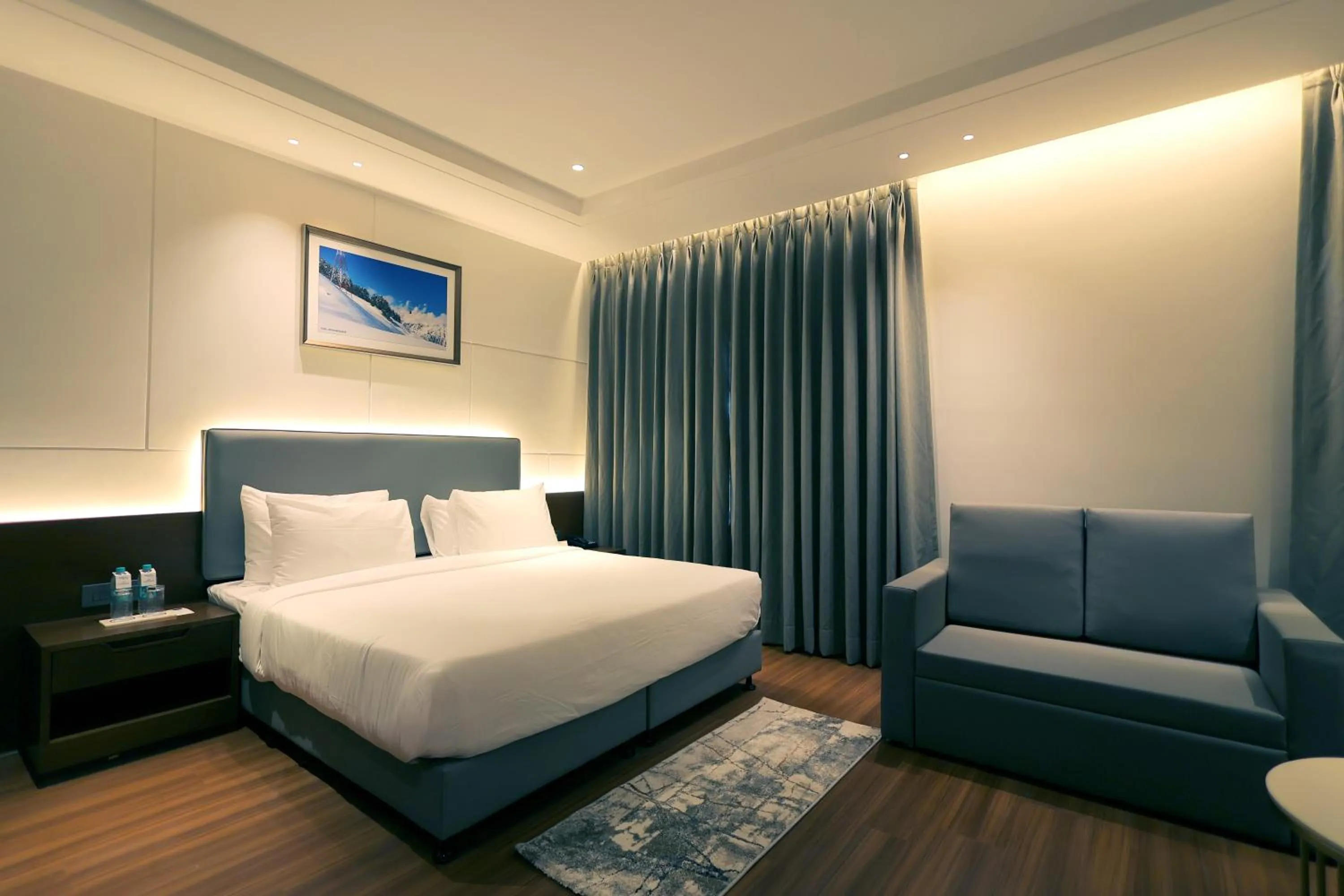 Seating area, Bed in Pride Elite Haridwar