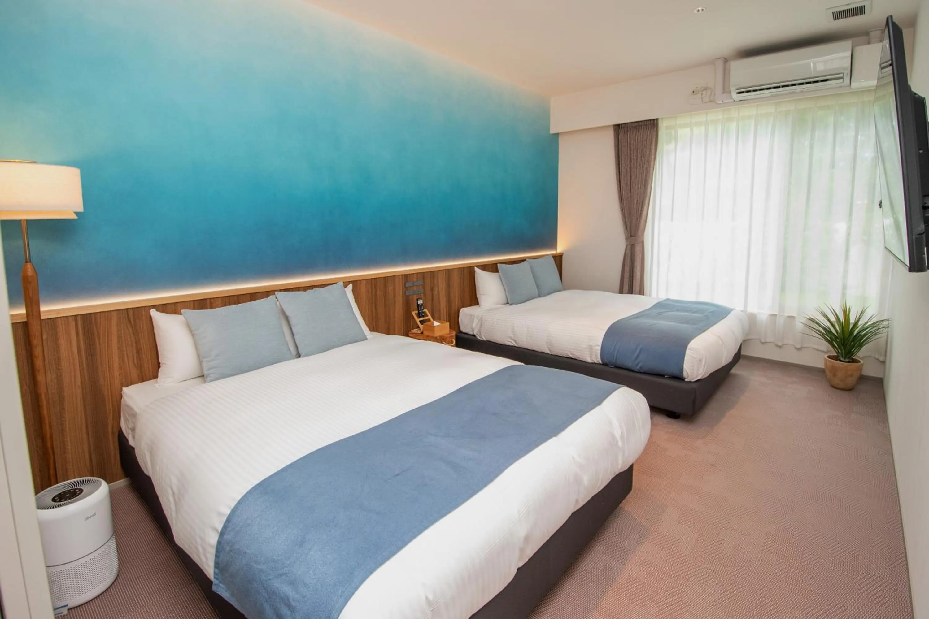 Bed in pool villa Sanrriott Okinawa Motobu