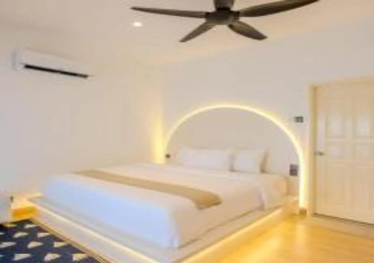Bed in Suntai Villa, Beachfront Suites