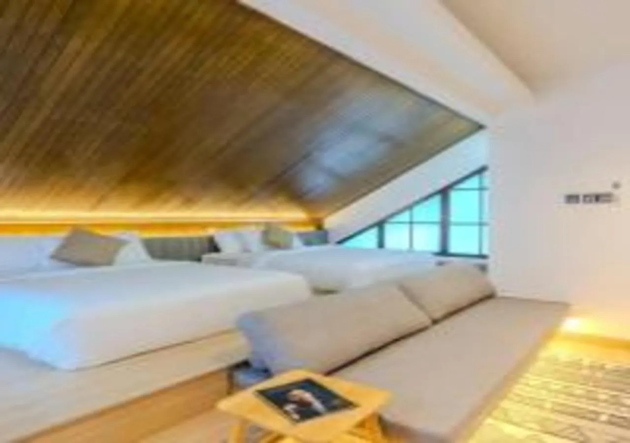 Bed in Suntai Villa, Beachfront Suites