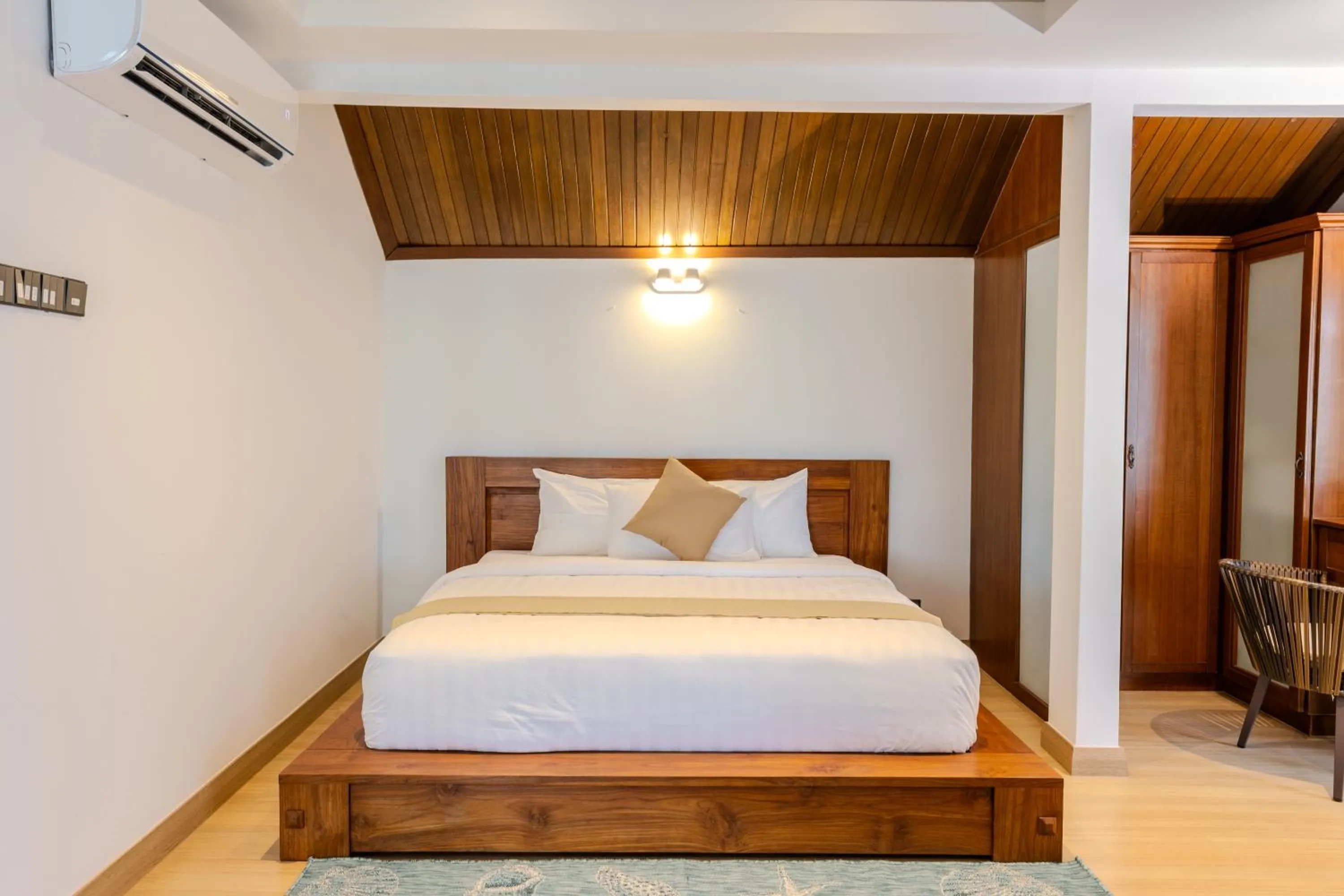 Bed in Suntai Villa, Beachfront Suites