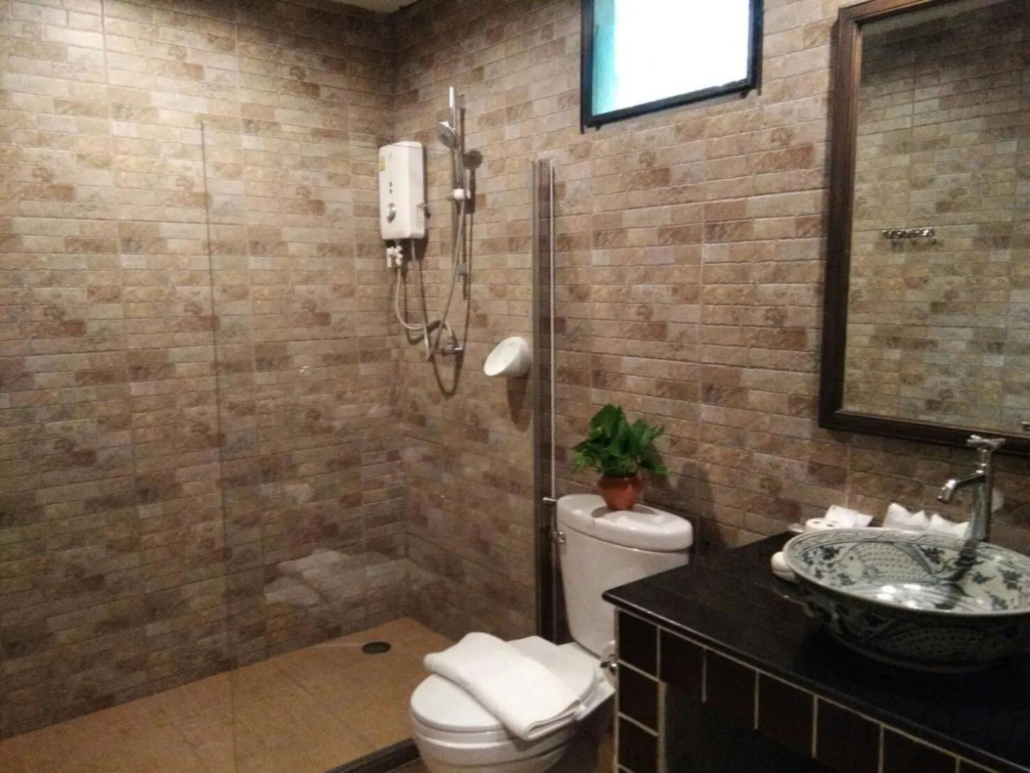 Shower in Scent of Sukhothai Resort