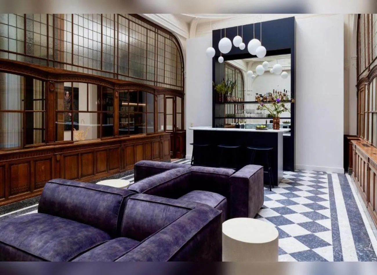 Communal lounge/ TV room in De Gulden Poorte, a LXRYHOME Hotel Collection