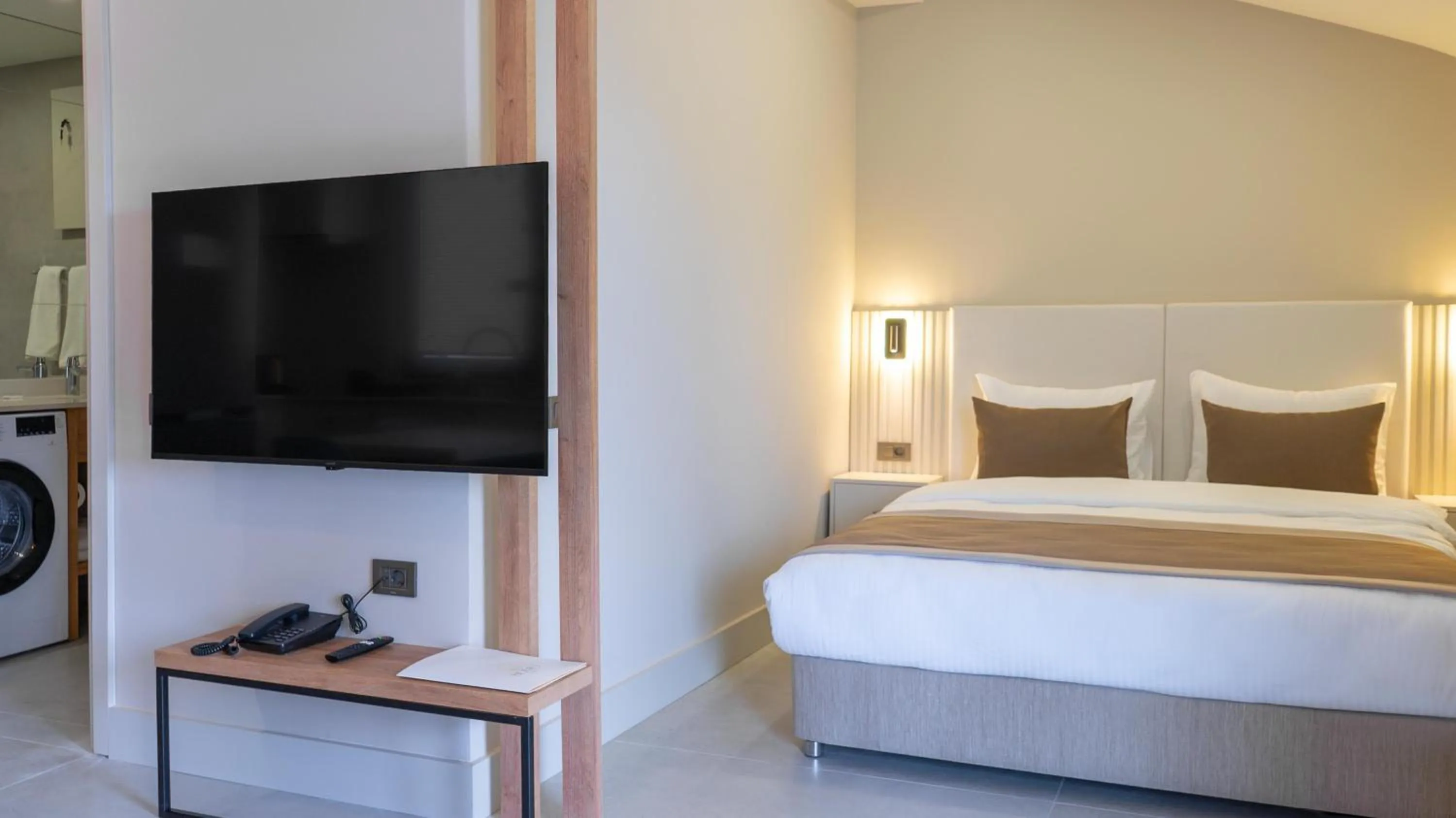 Photo of the whole room, Bed in Bomo Suites