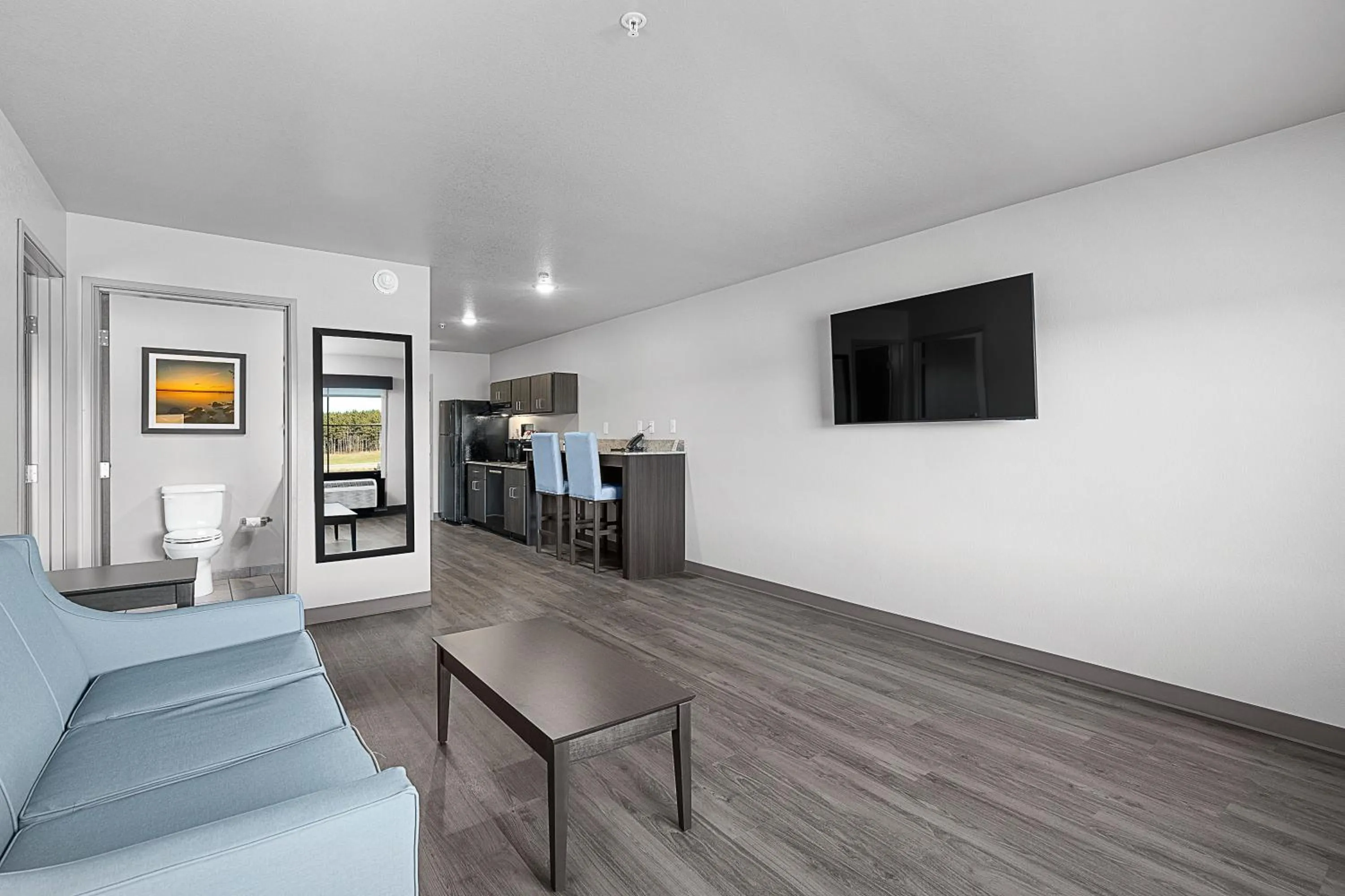 Living room in Riverstone Suites by Cobblestone Hotels - Chippewa Falls