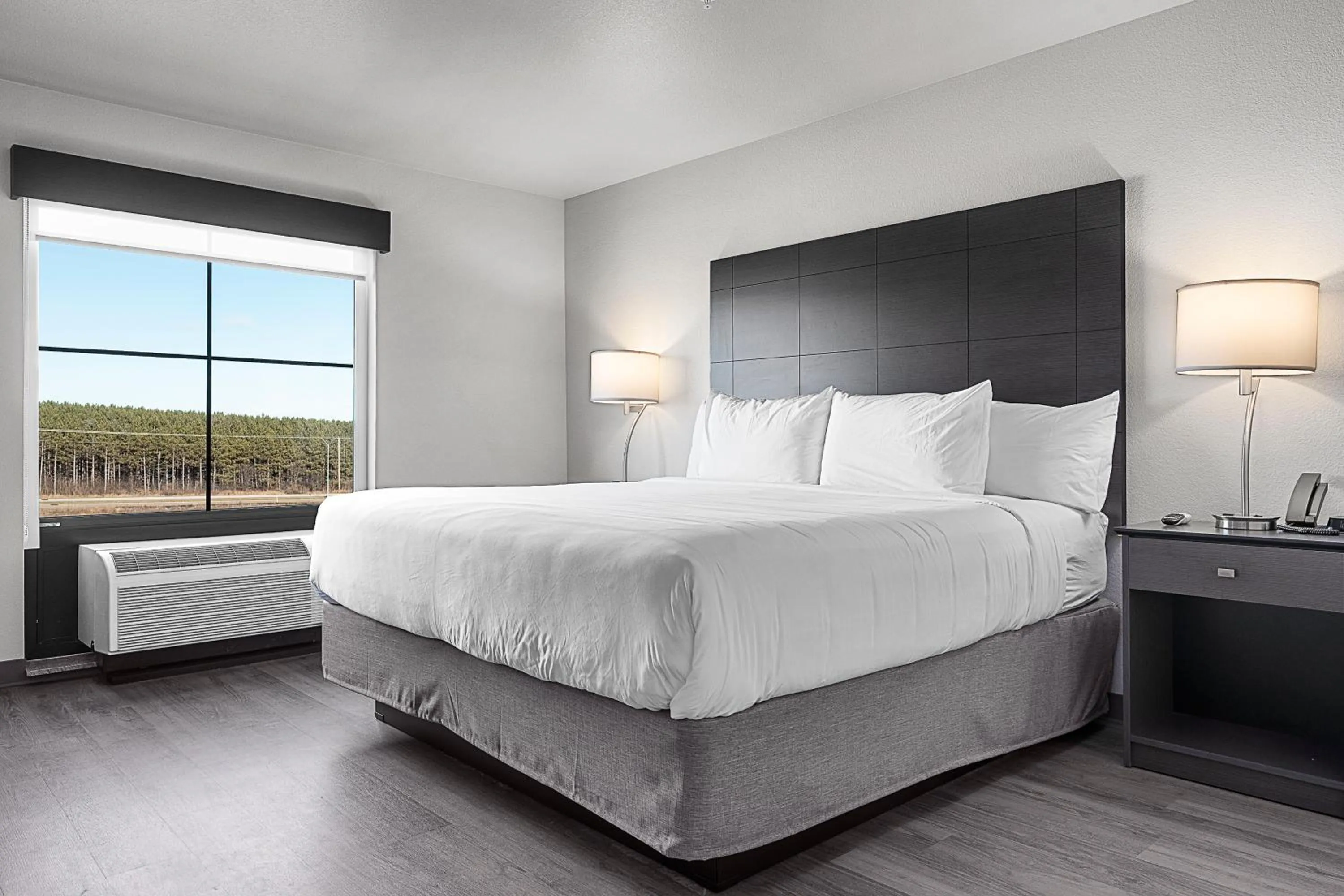 Bed in Riverstone Suites by Cobblestone Hotels - Chippewa Falls