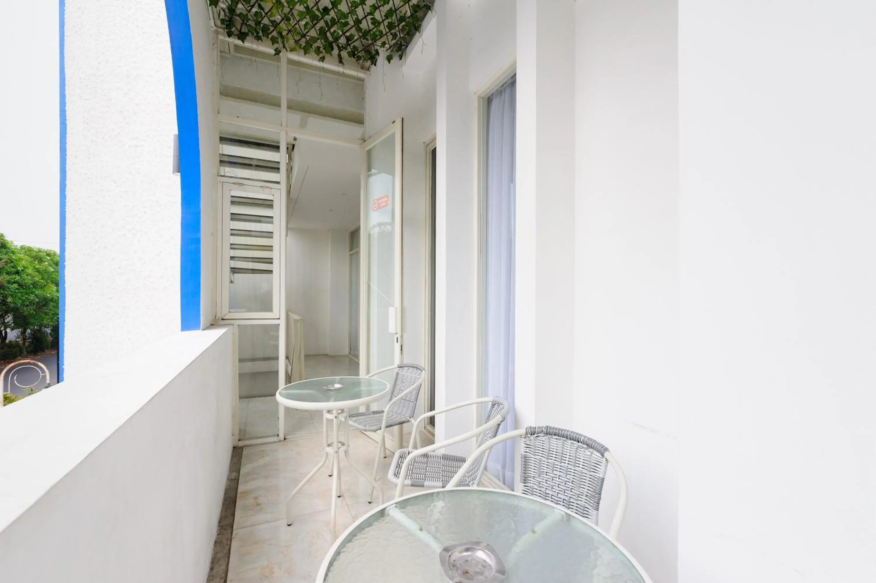 Seating area in Sans Hotel La Vida Malang